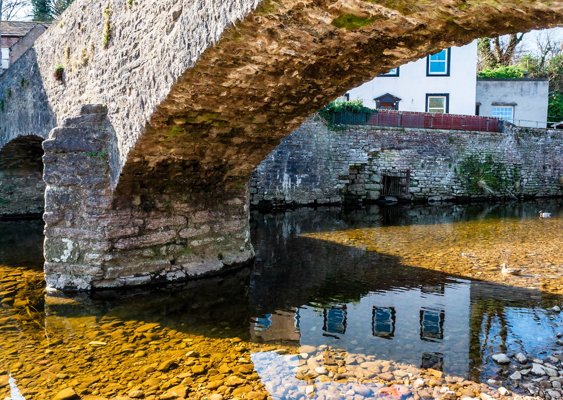A house relects in the River Eden as Frank's Bridge near the viliage of Kirkby Stephen.