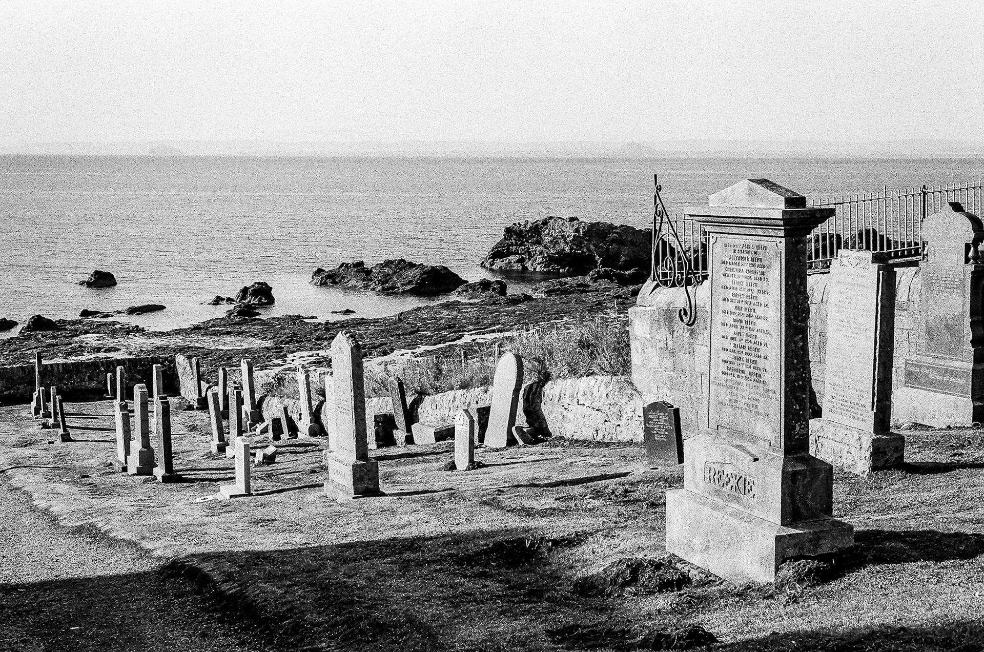 Graves stand locking out over the Firth of Forth at St Monans Kirk.