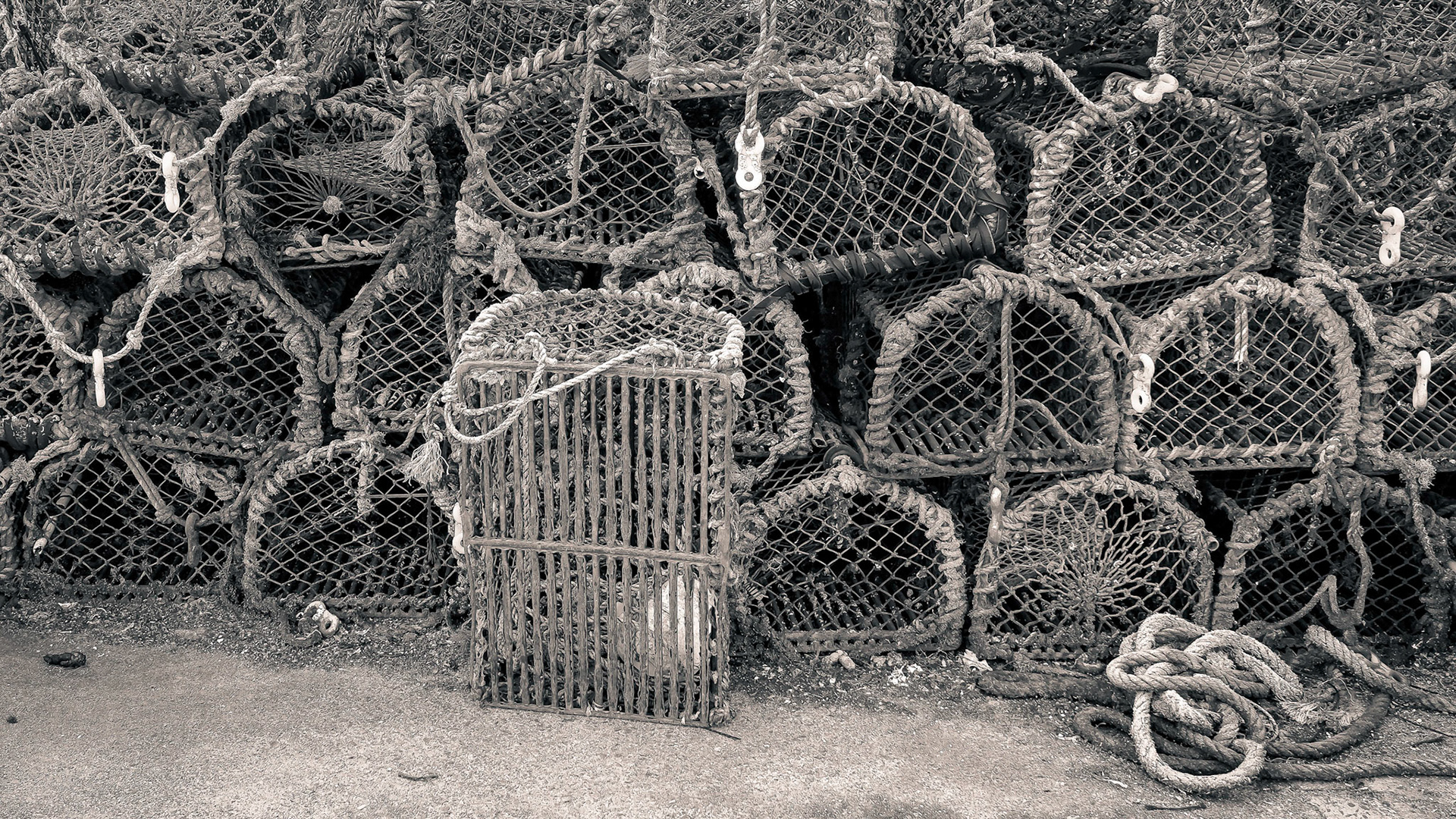 Traps stacked up on on a harbor quay.