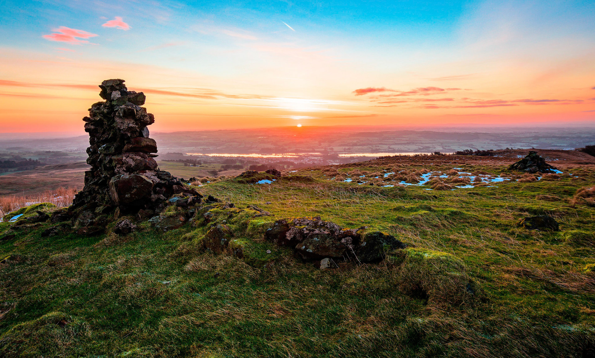 At sunrise the ruins of a shooting lodge sits on Lairdside Hill looking down on the Renfrewshire village of Lochwinnoch.