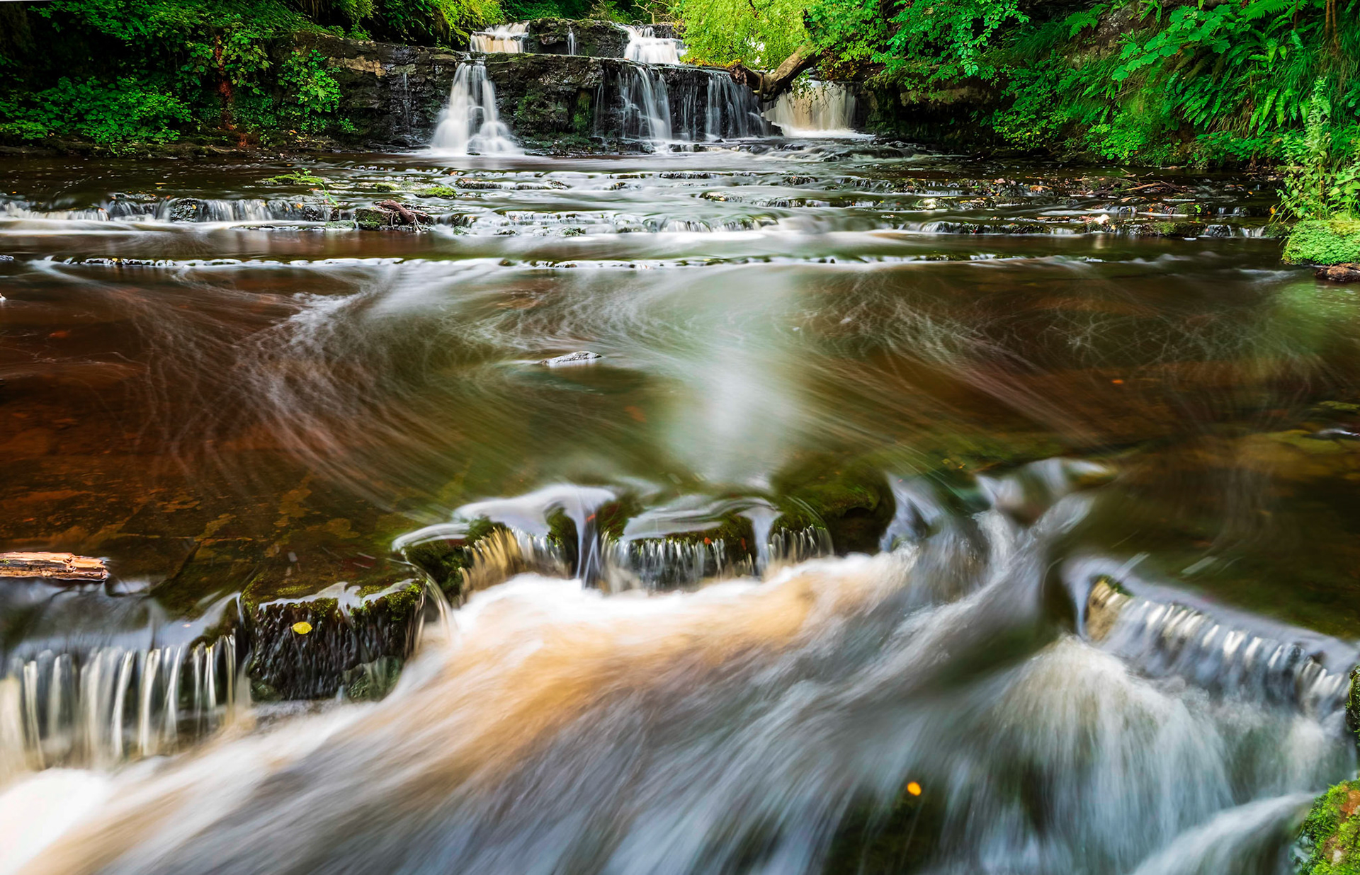 An early morning long exposure of Caaf Water flowing over Lynn Falls near the small North Ayrshire town of Dalry.