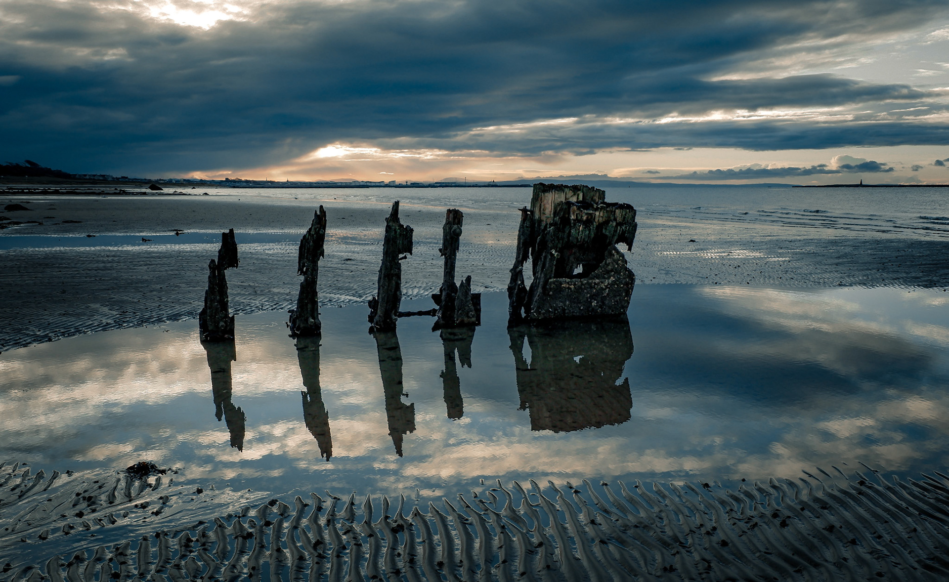Lonley groynes on a beach, West Kilbride, North Ayrshire, Scotland.