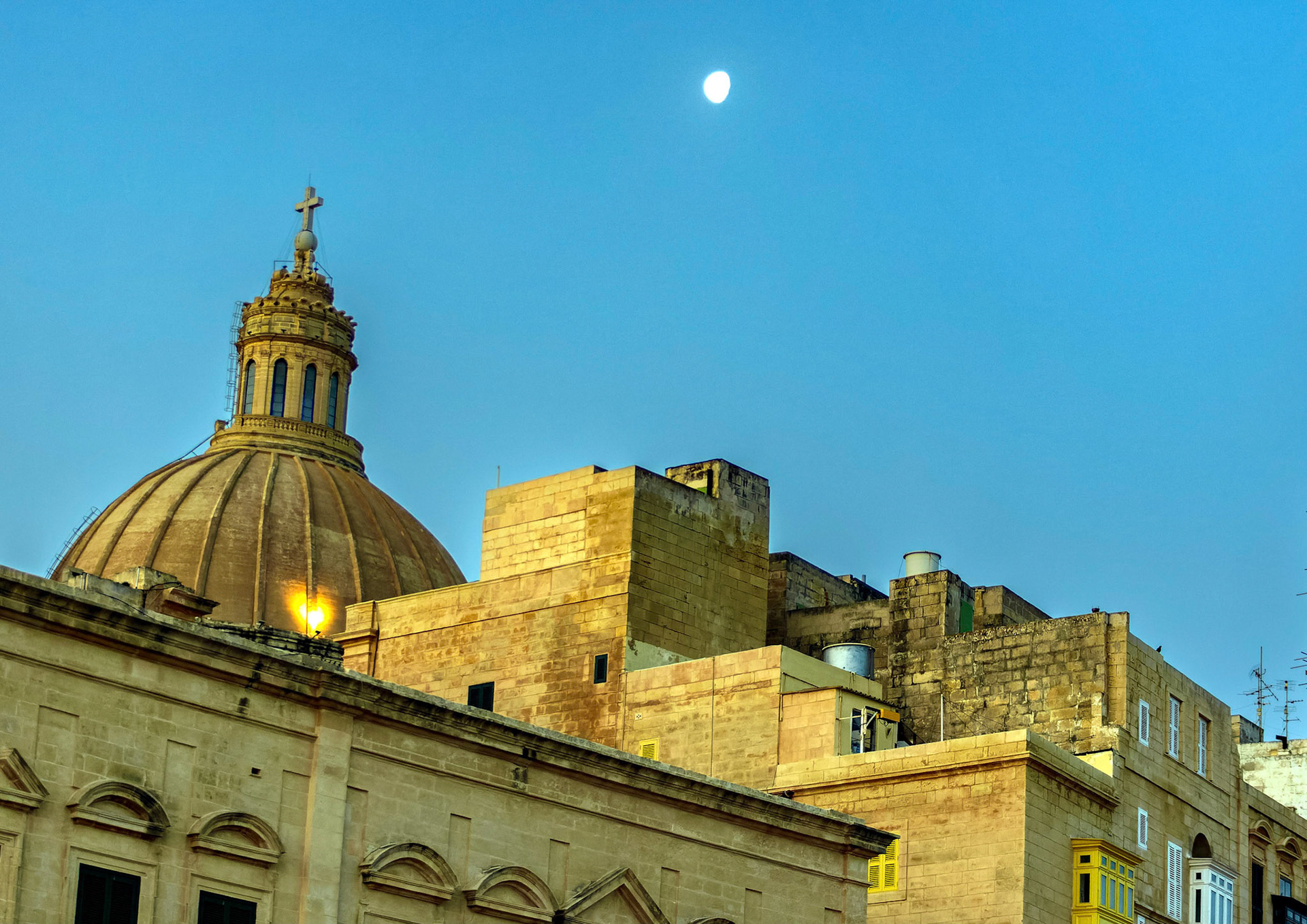 The Dome, Basilica of Our Lady of Mount Carmel sticks out above surrounding roofs, Valetta, Malta.