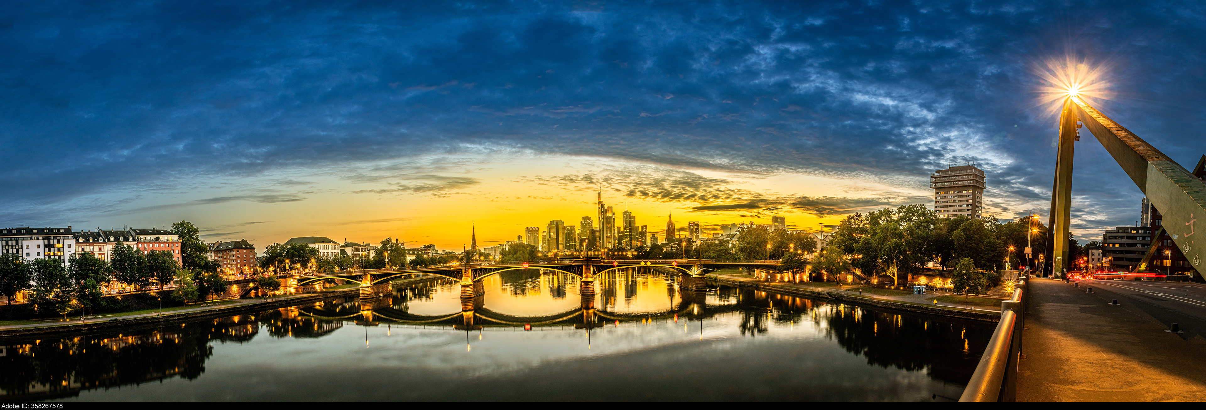 358267578  Panaroma high definition Frankfurt Skyline with blue sky and two bridges crossing the river main