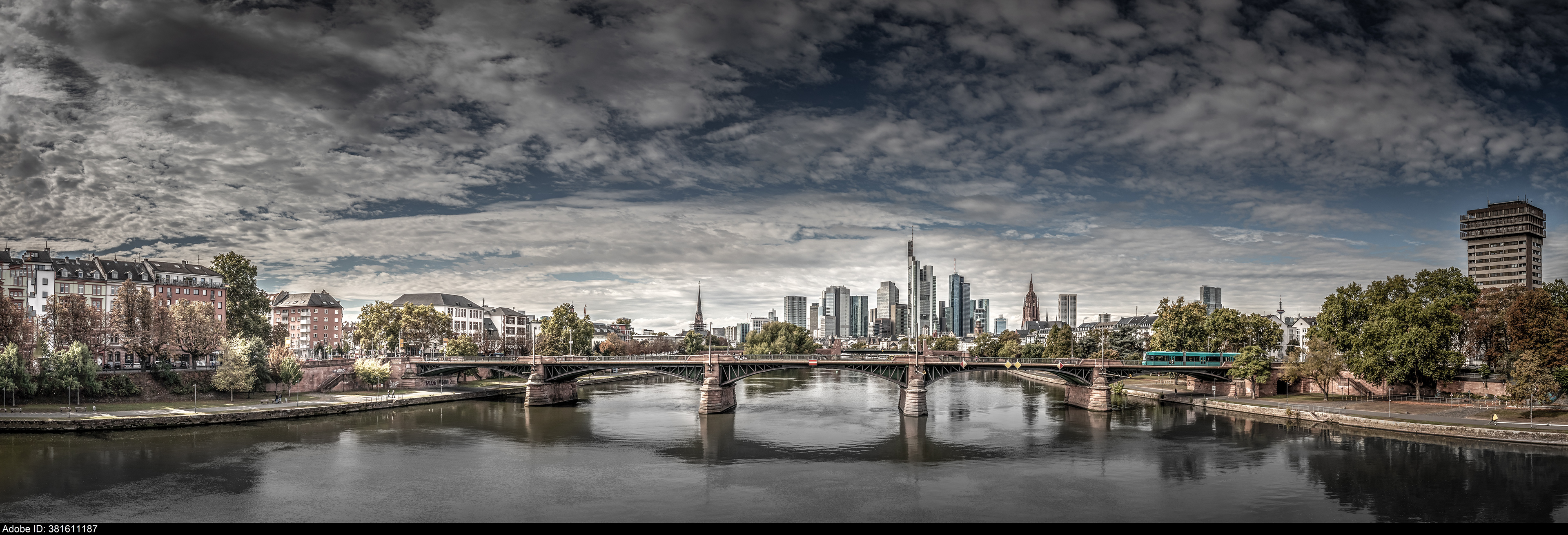 381611187  cloudy skies over Frankfurt Skyline