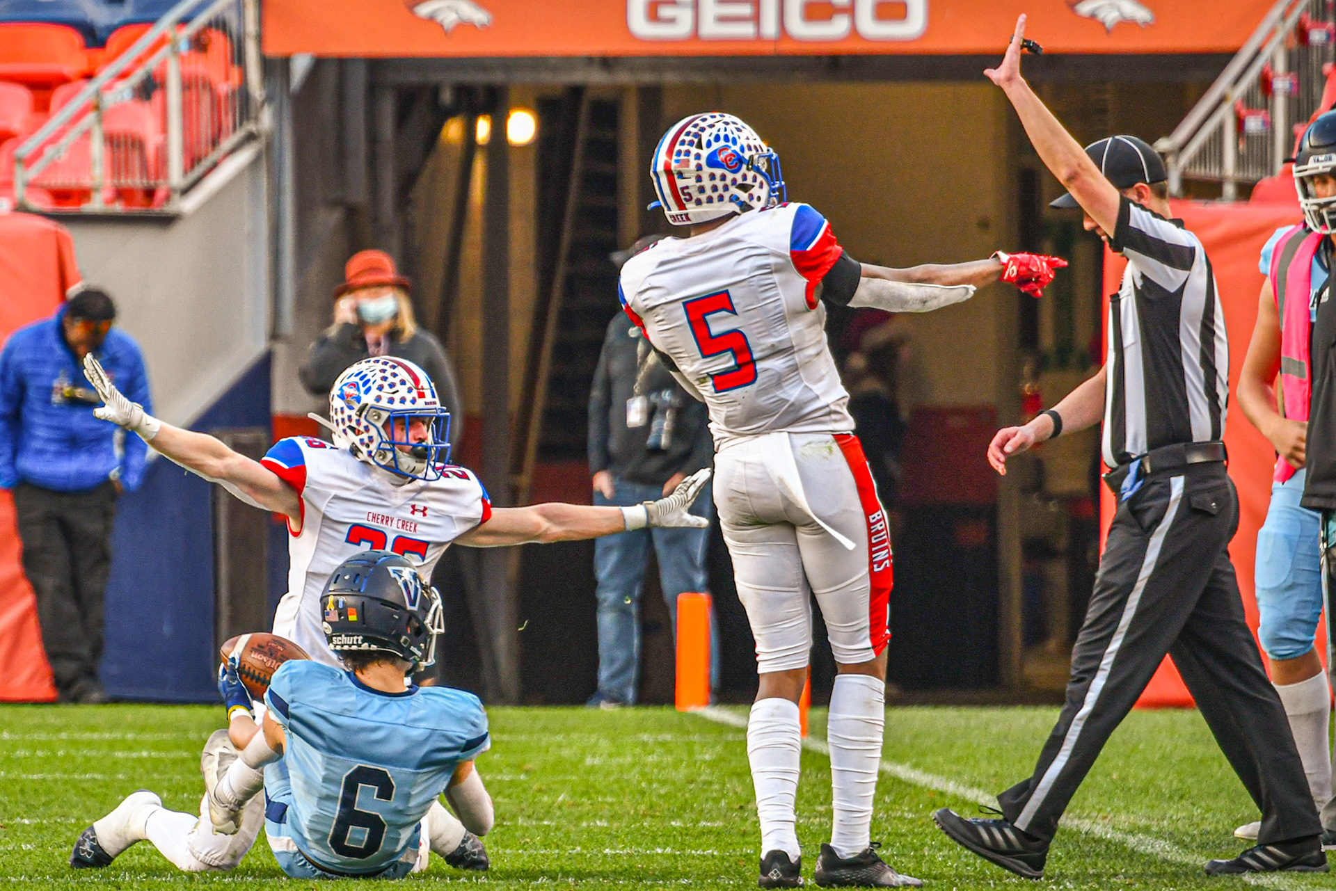In a disputed play at the 2021 5A Colorado State Football Championship game, two Cherry Creek defensive players try to influence the referee to rule the play an incomplete pass. Valor Christian was ultimately defeated in a 21-0 shutout by Cherry Creek.