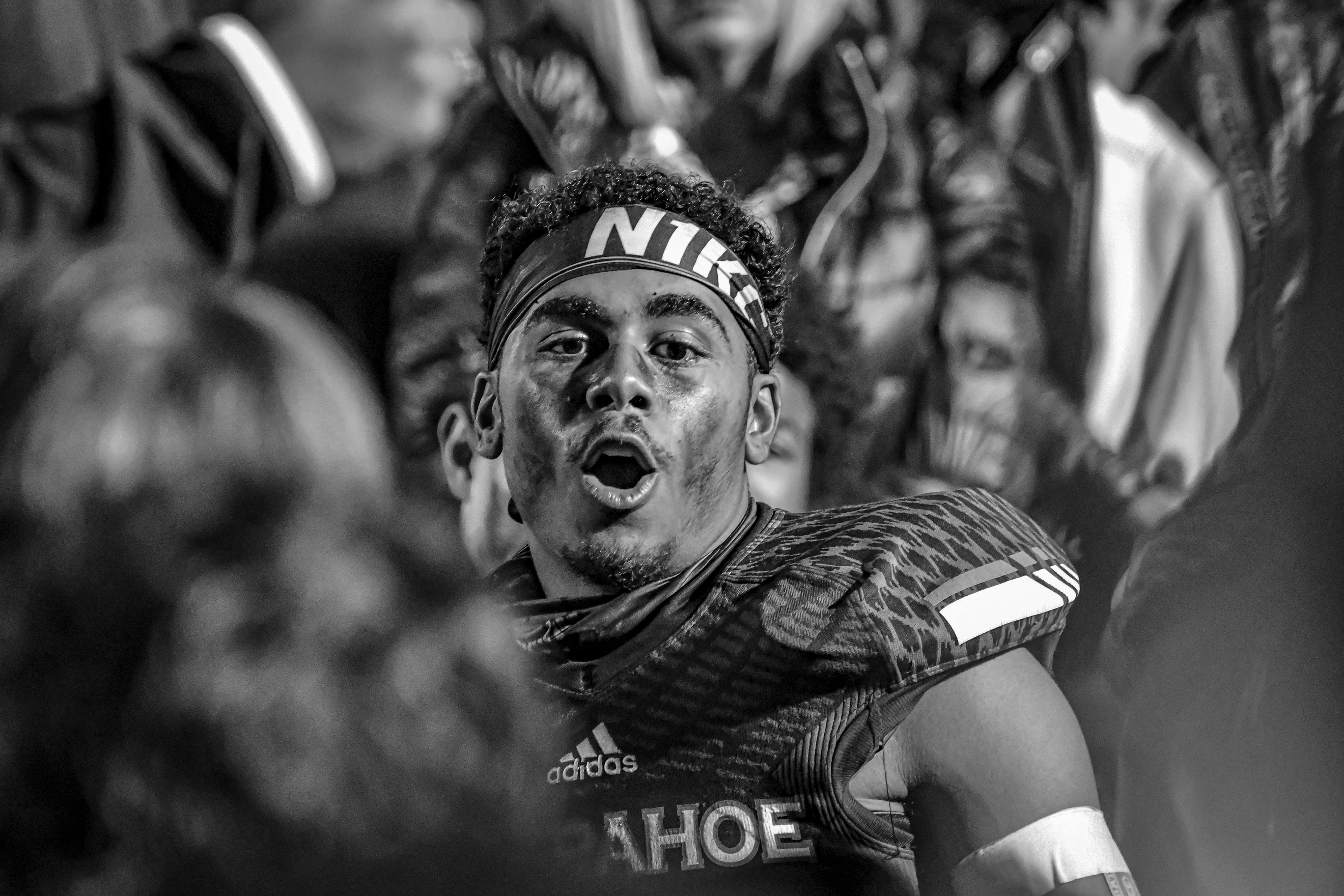 Celebrating a 42-24 win over Cherokee Trail on October 7th, 2021, Arapahoe sophomore Pyrshawn Miller, rallies in the huddle with his teammates. Miller played on the varsity team with his older brother, senior, Pyreese Miller, who contributed to many Warrior victories.