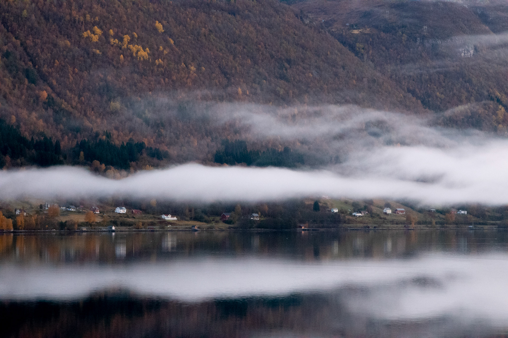 A serene tranquility of the Norwegian fjord. Sea, mountains and clouds. Peace. Awakenings. For the soul.