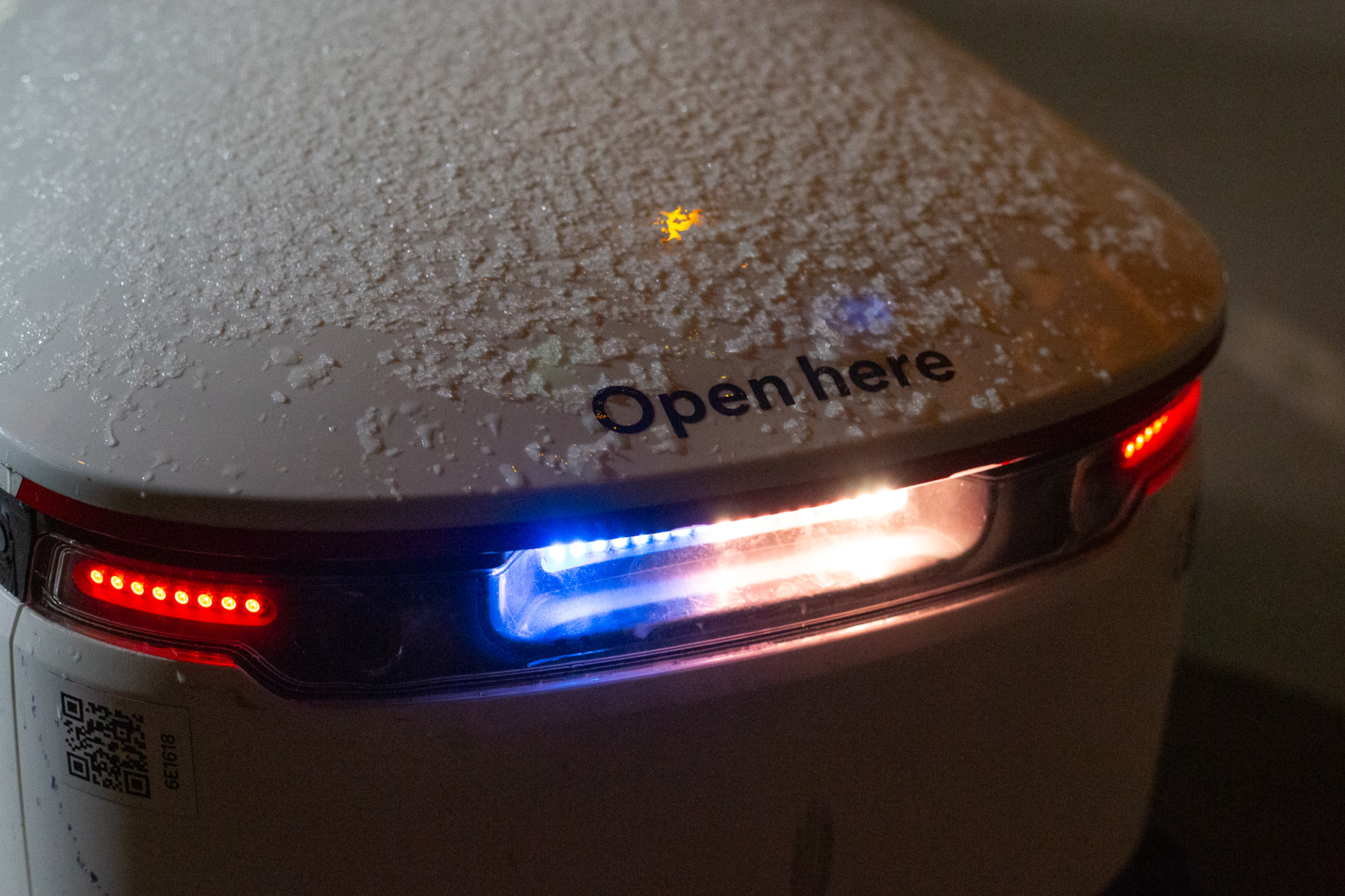 Snow coats the top of a Starship robot outside of the Communication building, March 7. 
