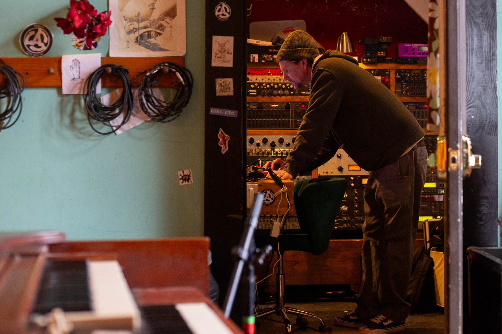 Triple A Sound Solutions audio engineer Andrew Baker works on a song from the recording booth at The Hive, March 7. 