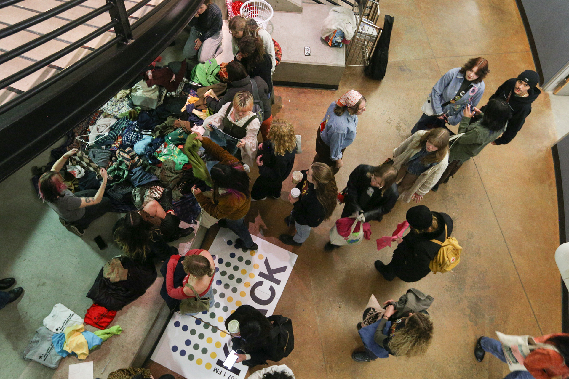 Northern Arizona University students sort through clothes during Woodswap, a clothing swap and open mic night hosted by KJACK and the NAU Fashion Club in the Communication building, March 22. 