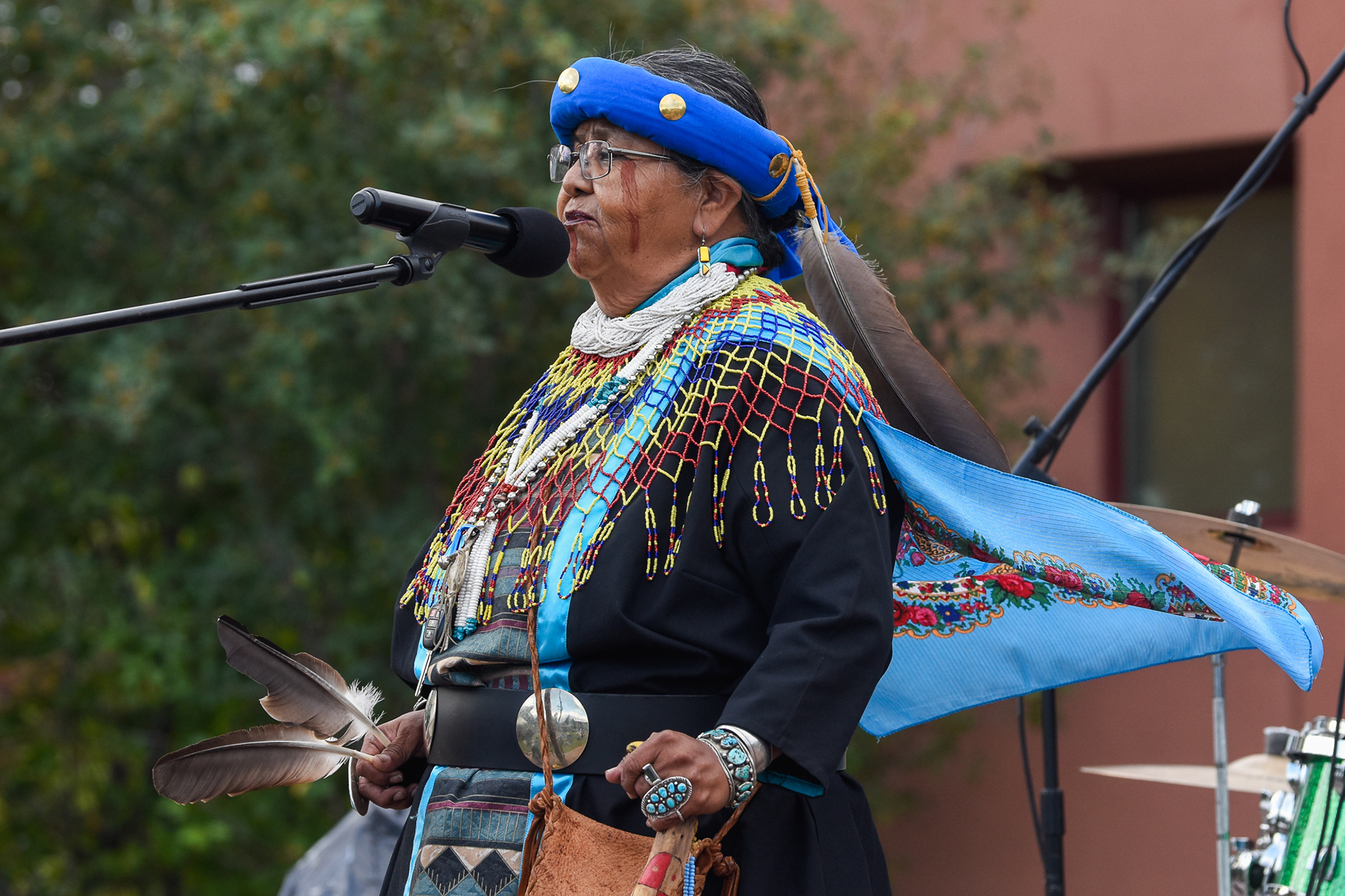 Havasupai tribal leader Dianna Sue White Dove Uqualla delivers a speech about the importance of protecting indigenous land at the ninth annual Rumble on the Mountain at the Native American Cultural Center, Sept. 9. Introduced by event organizer Ed Kabotie as a "warrior woman," Uqualla has been a fierce advocate for protecting the Grand Canyon against uranium mining, an issue at the forefront of the event the event's focus because of President Biden's recent designation of the Baaj Nwaavjo I’tah Kukveni – Ancestral Footprints of the Grand Canyon National Monument. 