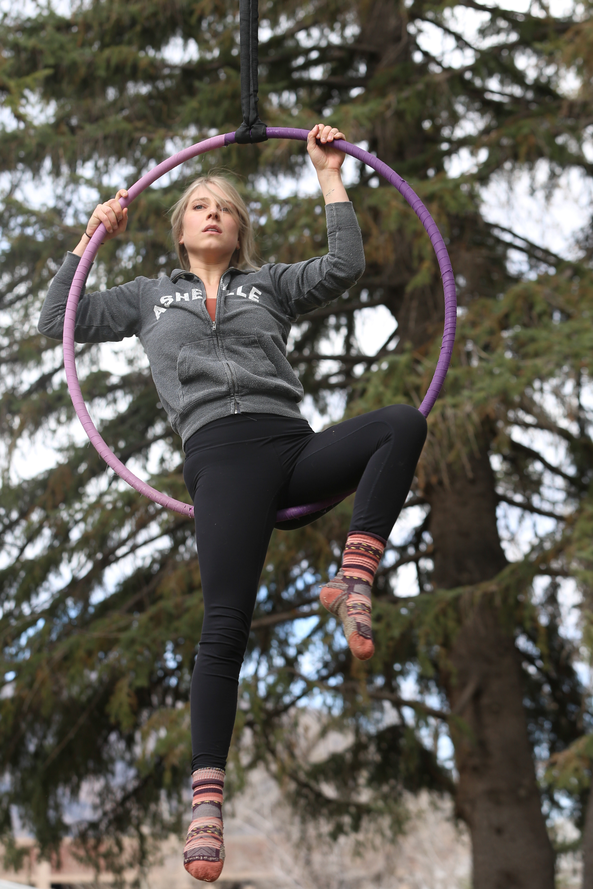 Performer Sunn Mixon does an aerial routine at Earth Jam in north  quad, April 22.
