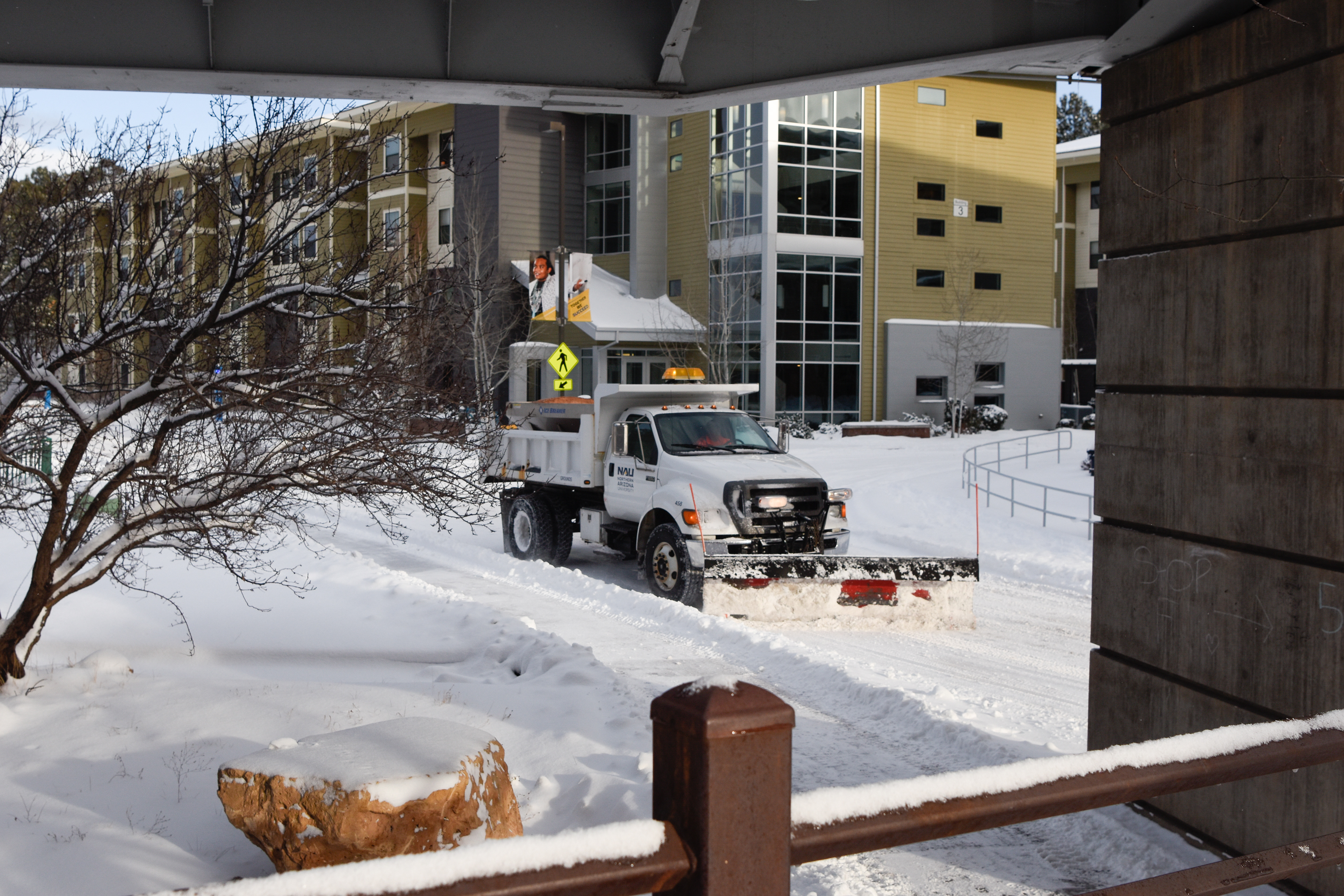 A truck plows snow on East McConnell Drive outside of The Suites, Jan. 7.