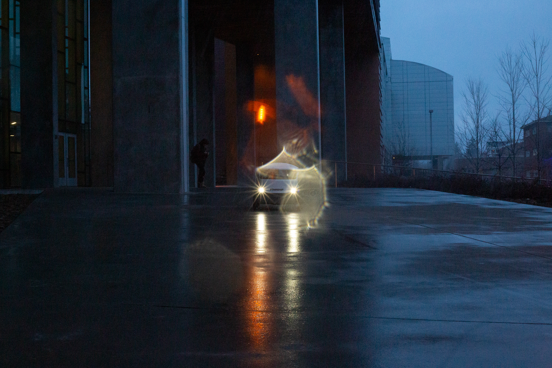 A Starship robot departs from the Science and Health building, March 7.