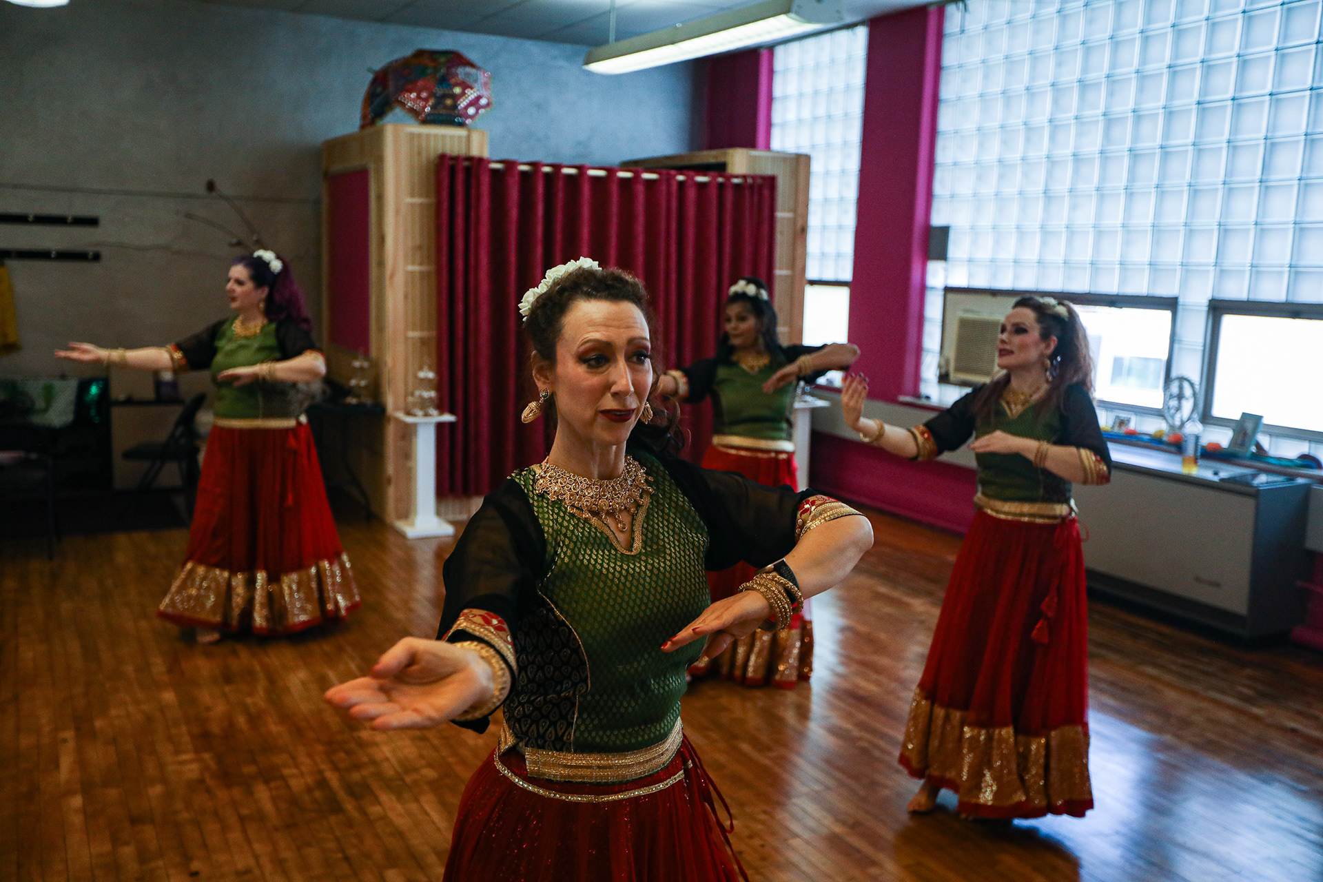 Tiffany Adamski, center, leads the group through a series of moves at a Naach by Aha Bollywood dance rehearsal in Toledo on Sunday, July 10, 2022. For Toledo Blade.