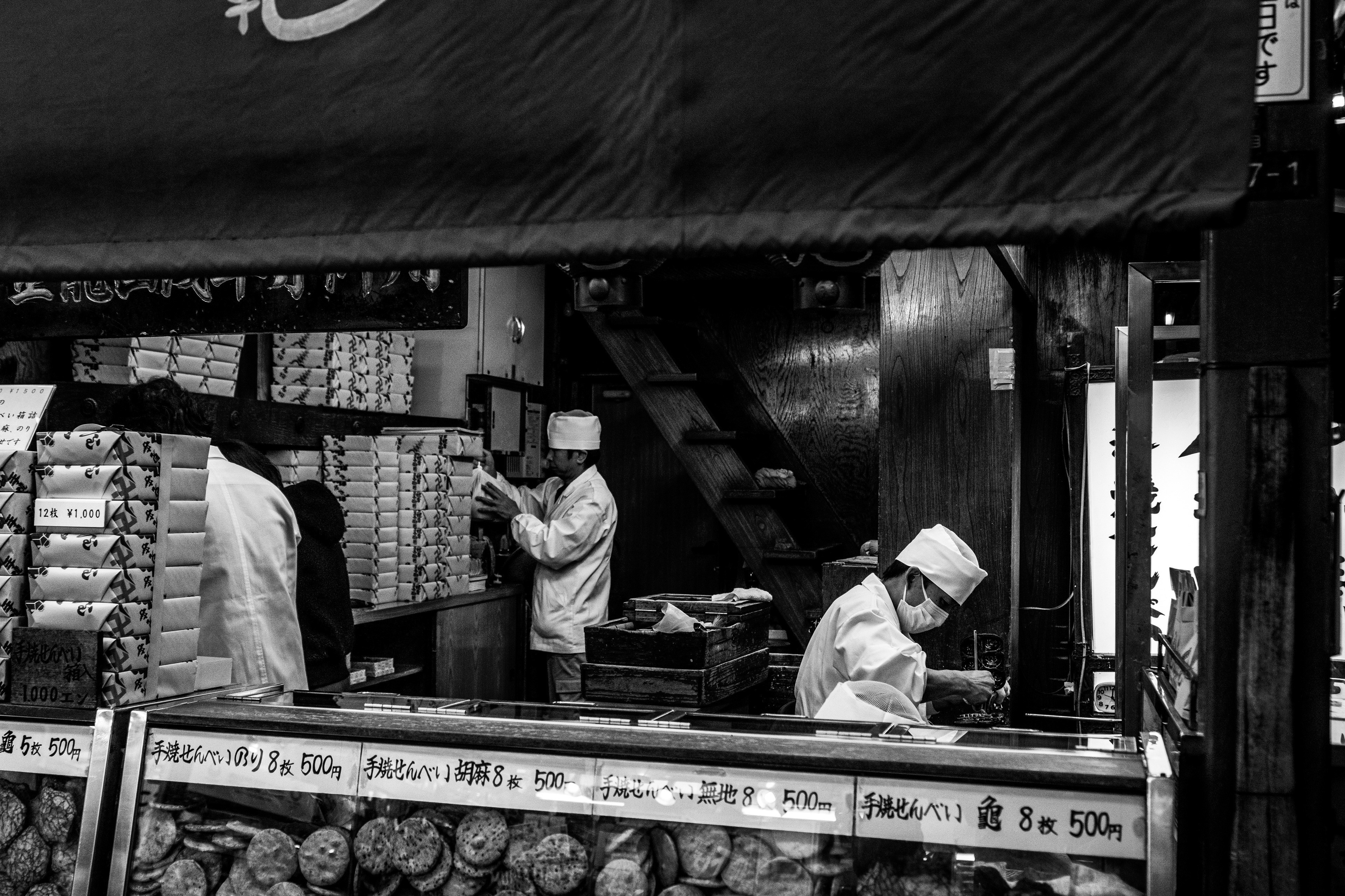 Chefs work in a food stall in Tokyo, Japan.