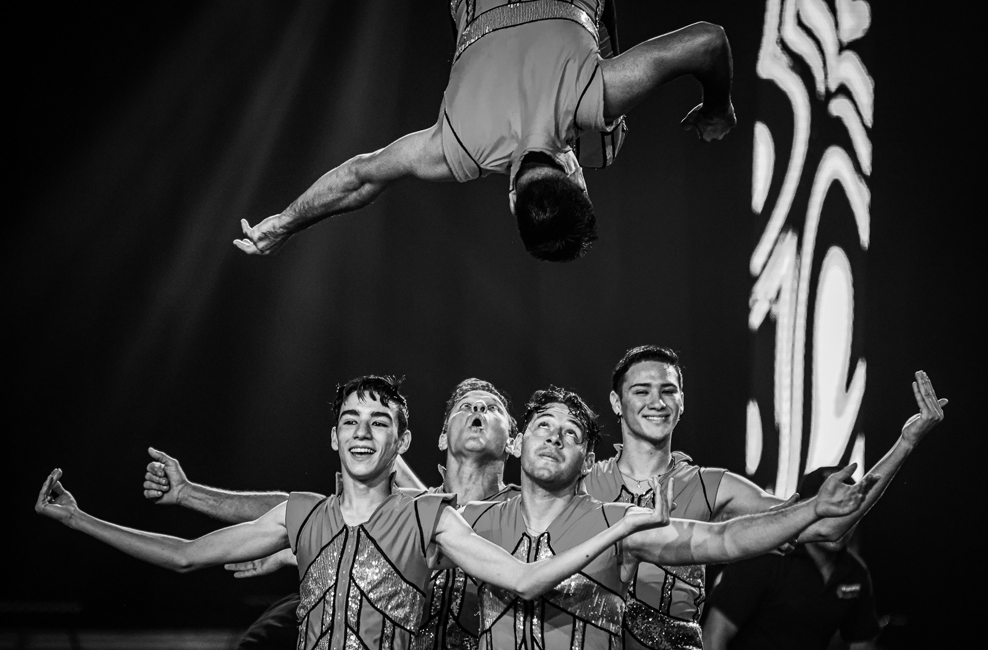 An acrobat does a flip over other performers at Garden Bros Nuclear Circus in Toledo on Sunday, September 4, 2022. For Toledo Blade.