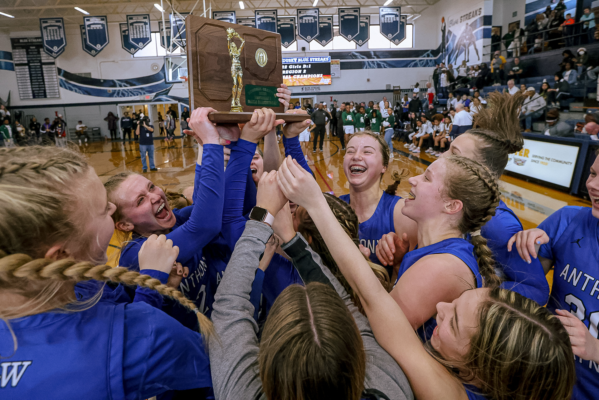 Anthony Wayne players hold up their trophy after winning  the Division I girls basketball regional final in Sandusky on Saturday, March 5, 2022. For Toledo Blade.