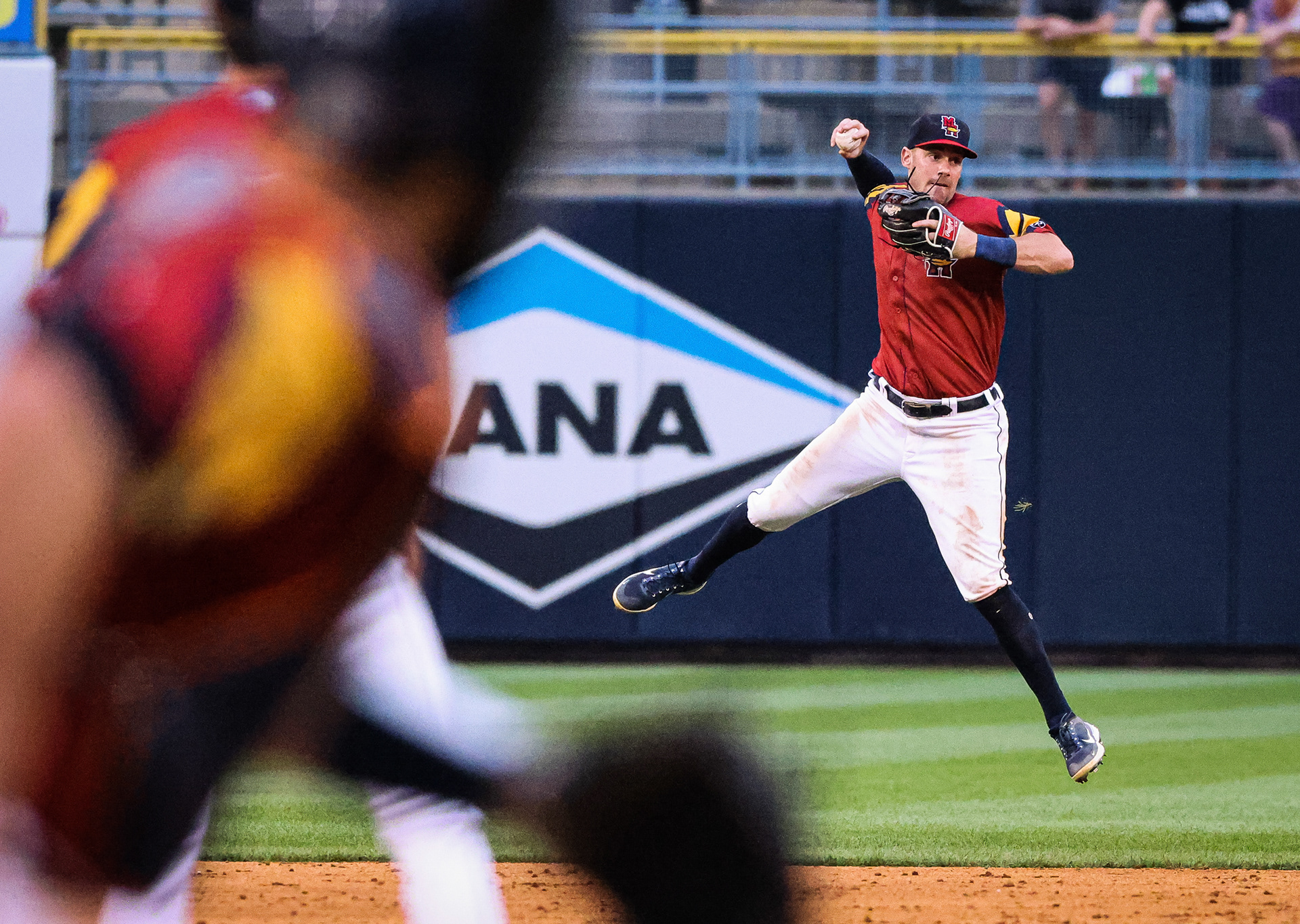 Toledo Mud Hens’s Andre Lipcius jumps in the air to throw the ball back to first base at Fifth Third Field in Toledo on Thursday, August 25, 2022. For Toledo Blade.