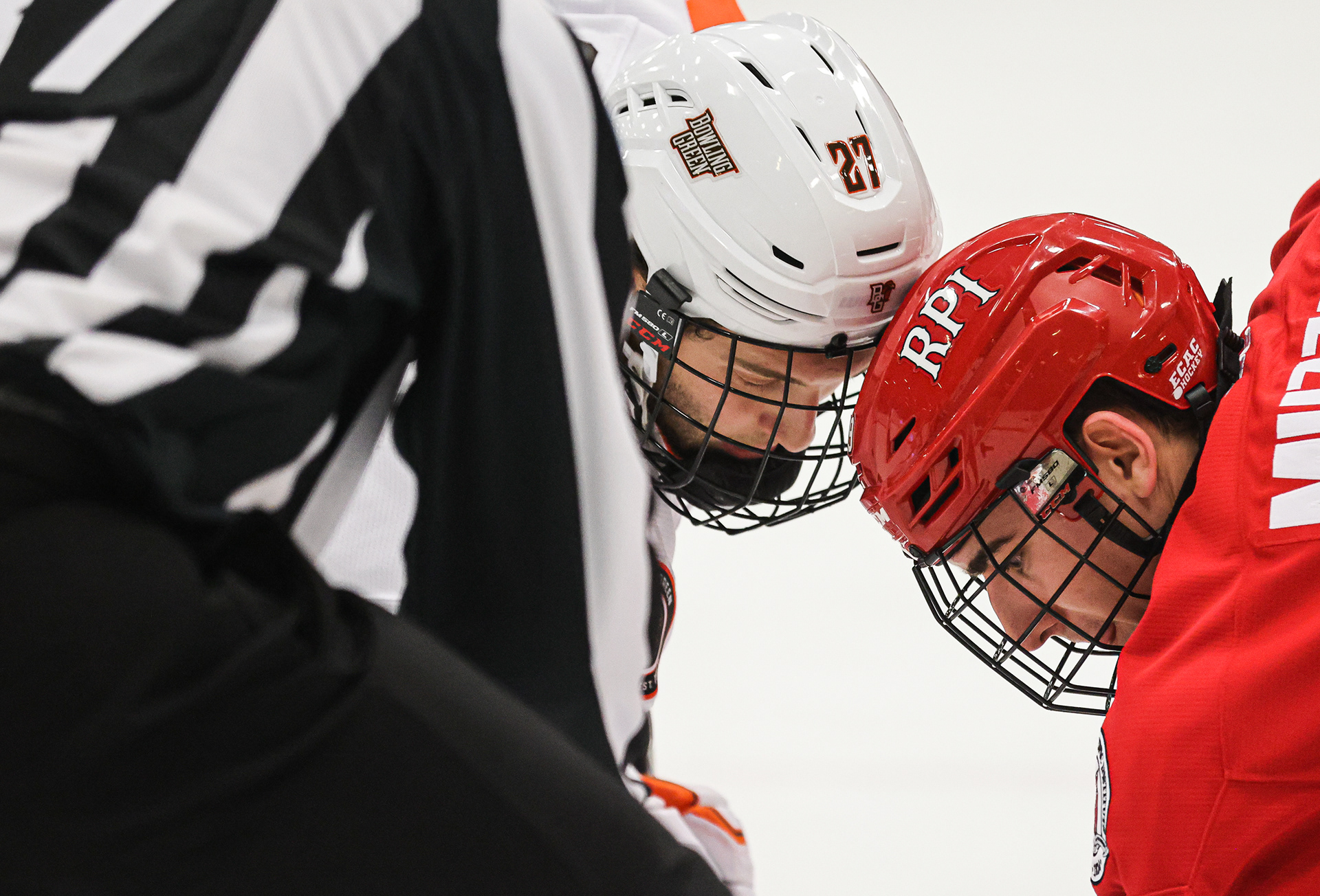 Bowling Green’s Chase Gresock (27) and RPI’s Sutter Muzzatti (19) prepare for a puck drop at Slater Family Ice Arena in Bowling Green, Ohio on Thursday, December 29, 2022. For Toledo Blade.