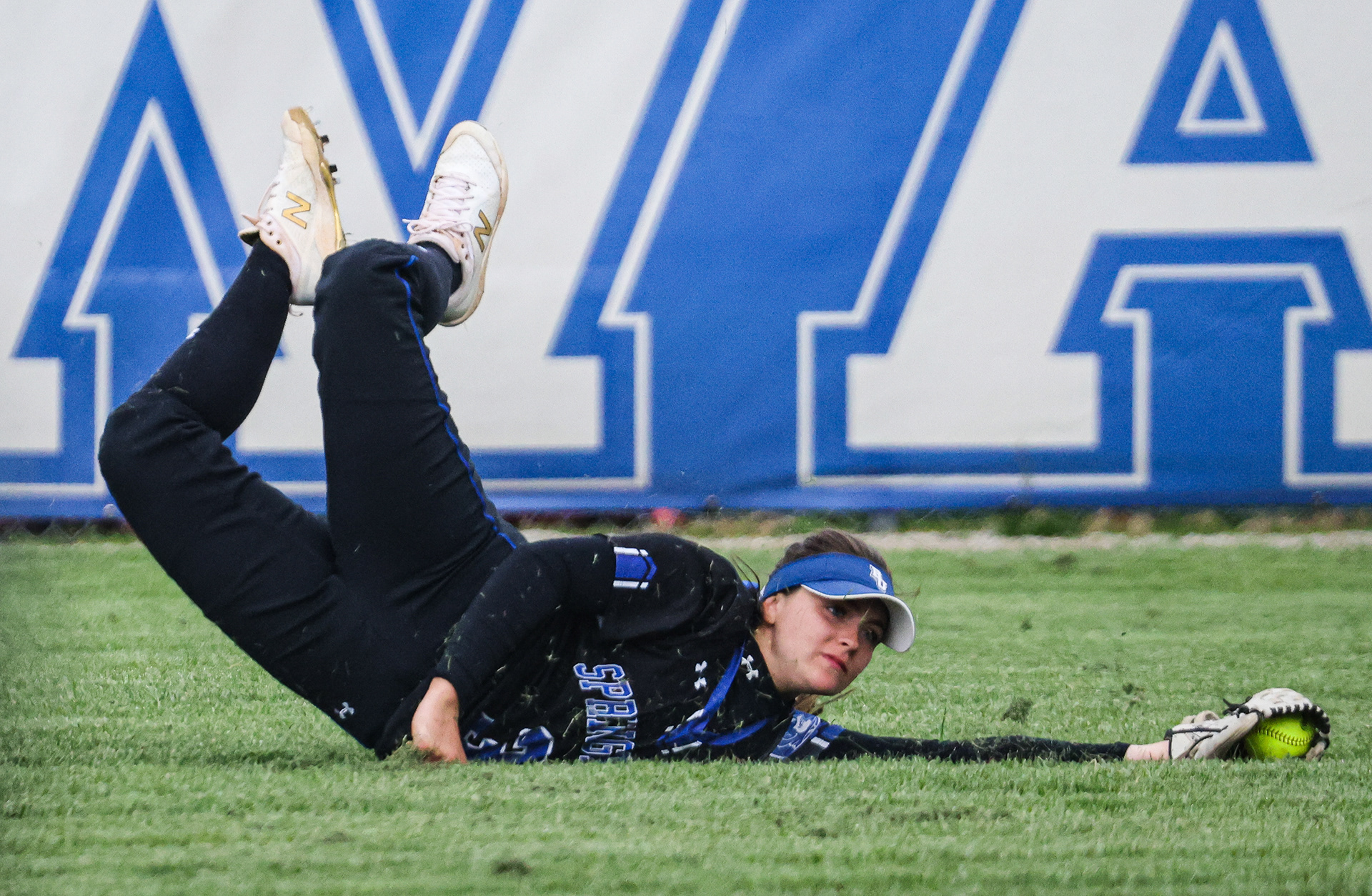Springfield’s Maddie Darrah hits the ground as she catches a ball in the outfield in Whitehouse, Ohio on Friday, April 22, 2022. For Toledo Blade.