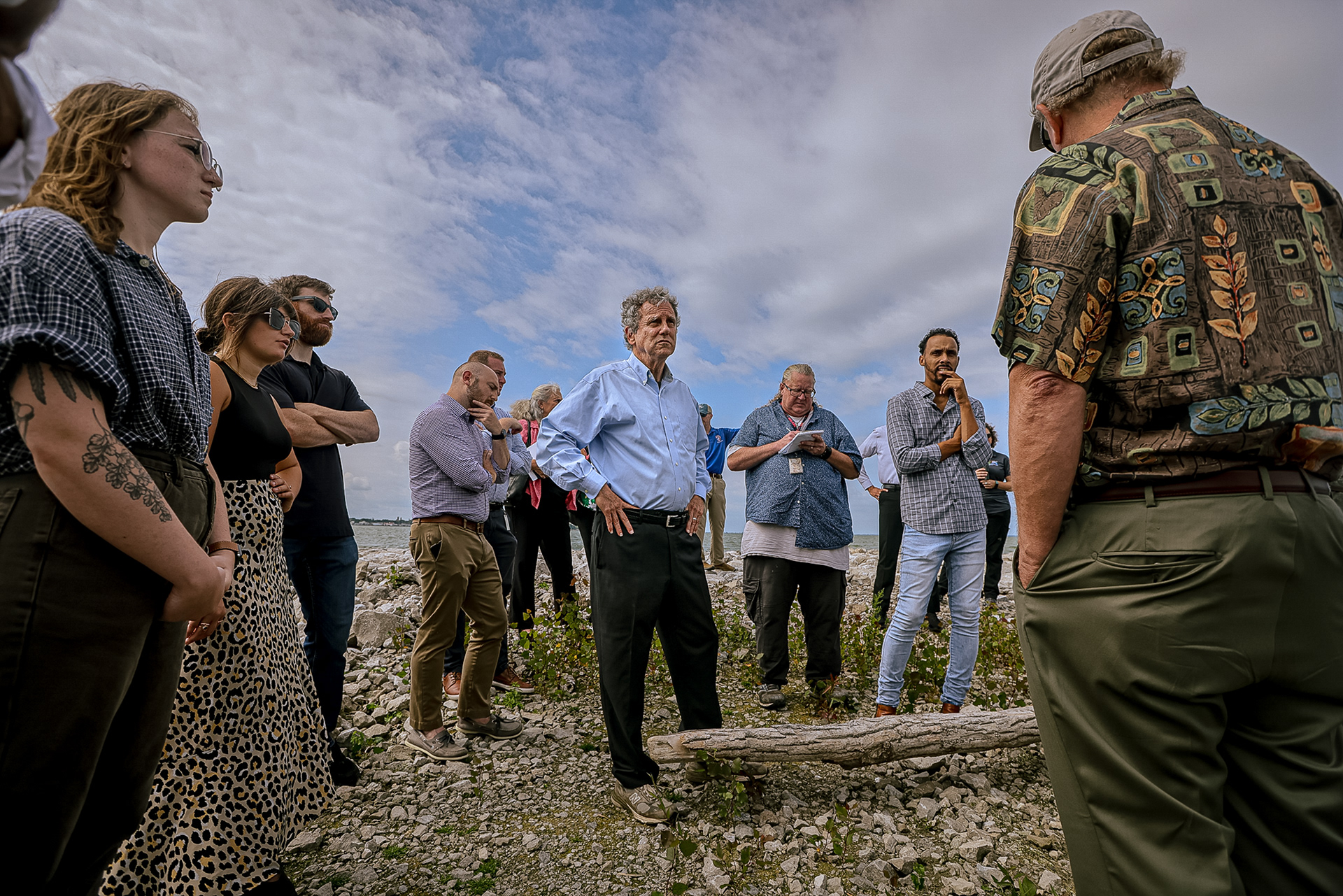 US Sen. Sherrod Brown, center, listens to the science behind the Cedar Point Causeway Wetlands Project at the western side of Sandusky Bay near Cedar Point Causeway in Sandusky, Ohio on Monday, September 19, 2022. For Toledo Blade.