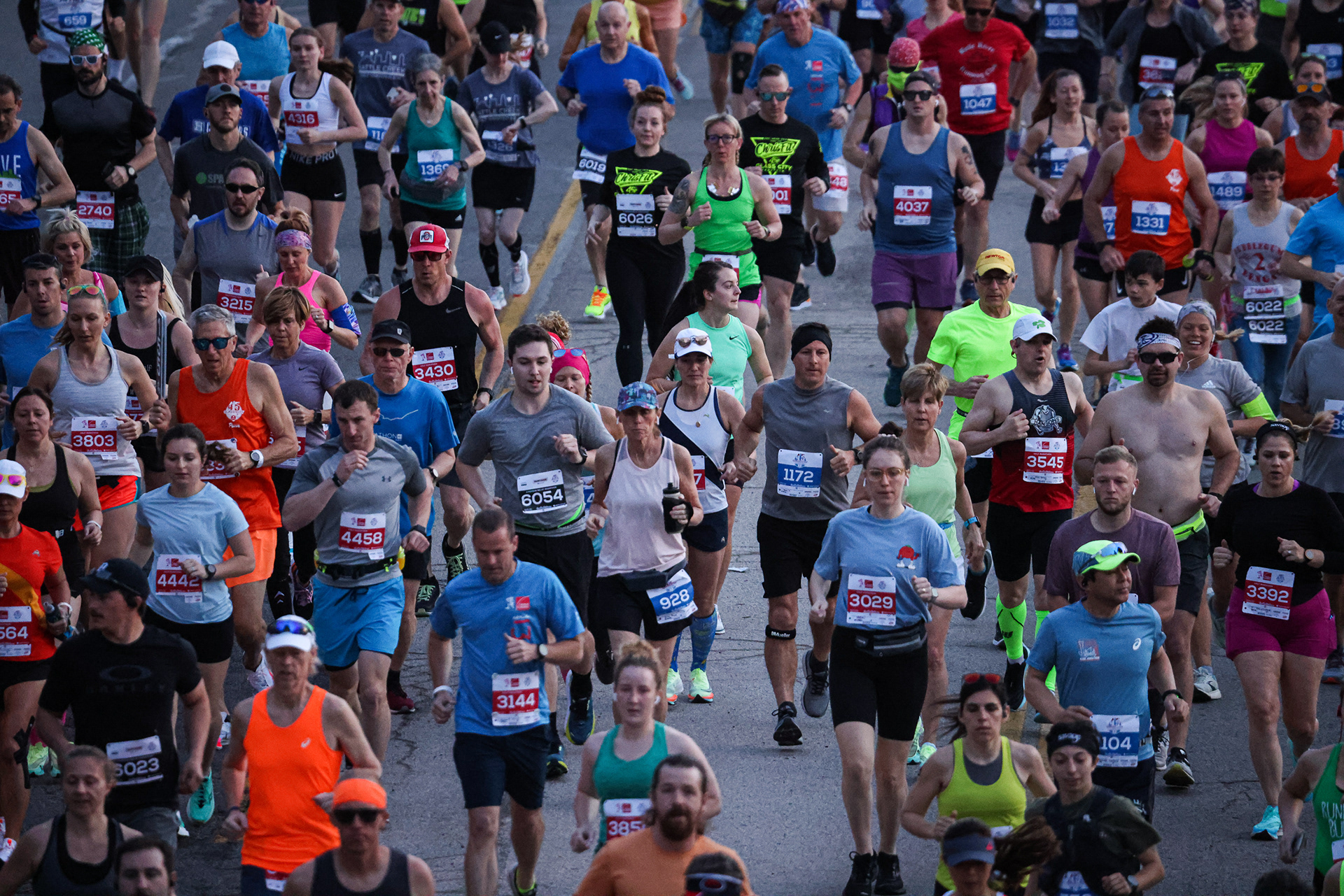 Hundreds of runners take off from the starting line at the Mercy Health Glass City Marathon in Toledo, Ohio on Sunday, April 24, 2022. For Toledo Blade.