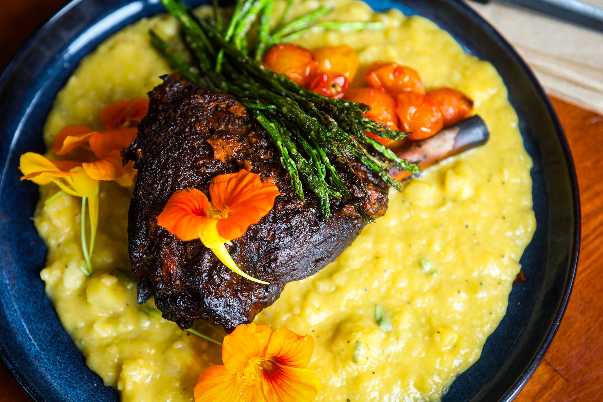 Braised lamb shank prepared by Tyler Nickel in Ellsworth, Maine. 