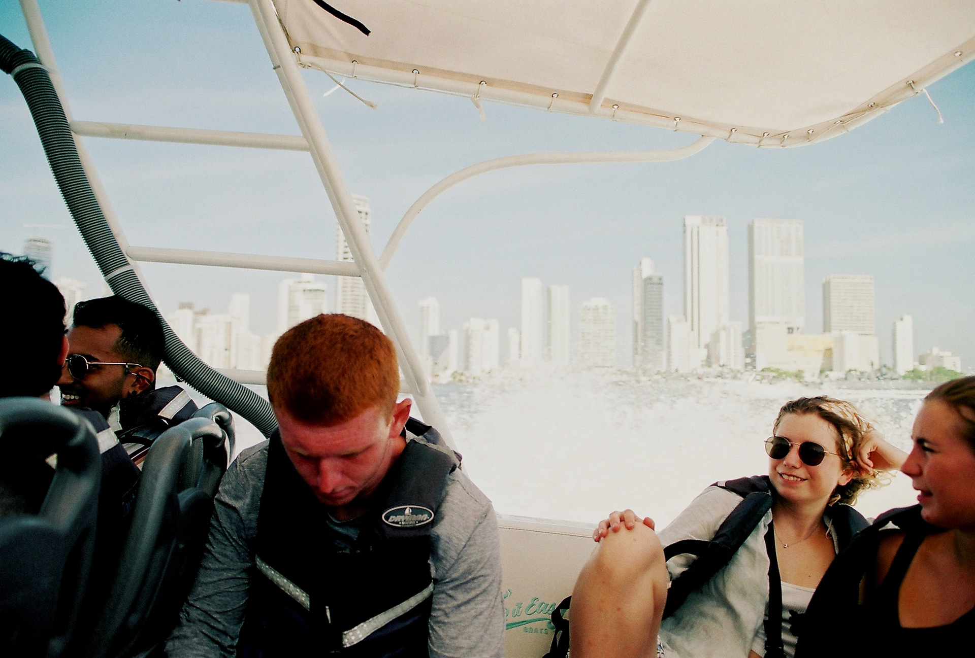 Tourists sleep on a boat leaving Cartagena, Colombia. 2022.