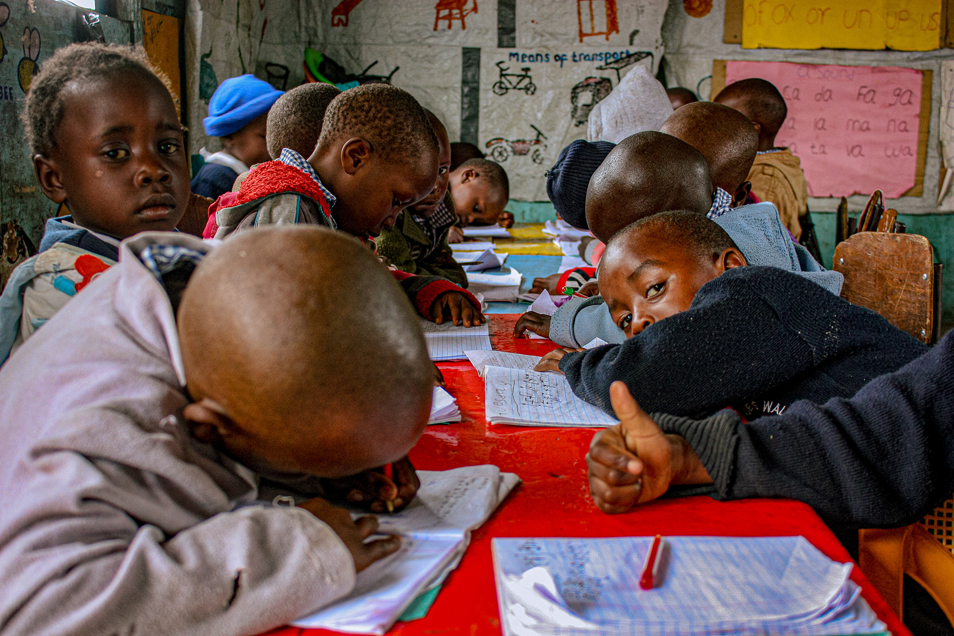 Students work on a writing exercise at The Walk Centre primary school in Nakuru, Kenya on July 12, 2016.