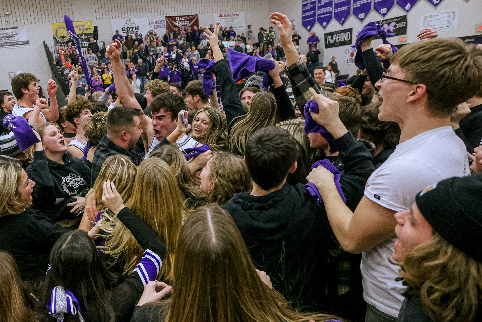 Swanton High School varsity basketball players and fans converge on the court after winning the boys basketball game against Archbold at Swanton High School on Friday, February 11, 2022. The win gave the team at least co-share of the NWOAL for the third time in history. For Toledo Blade.