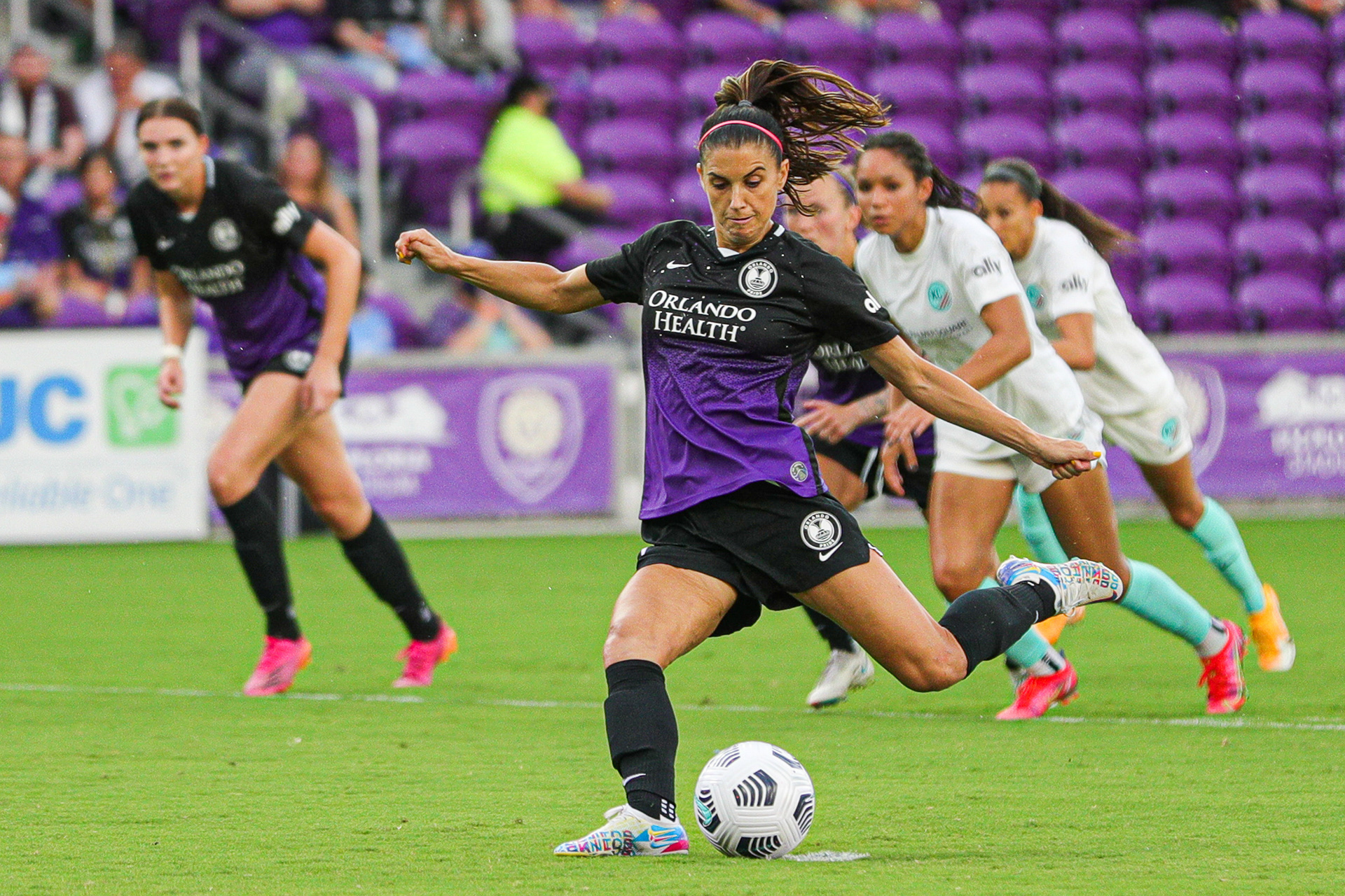 Alex Morgan (13) kicks the ball towards the goal during the Orlando Pride home game at Exploria Stadium against Kansas City on Sunday, May 30, 2021. The Pride won the game 1-0 after four minutes of overtime. For Orlando Sentinel.