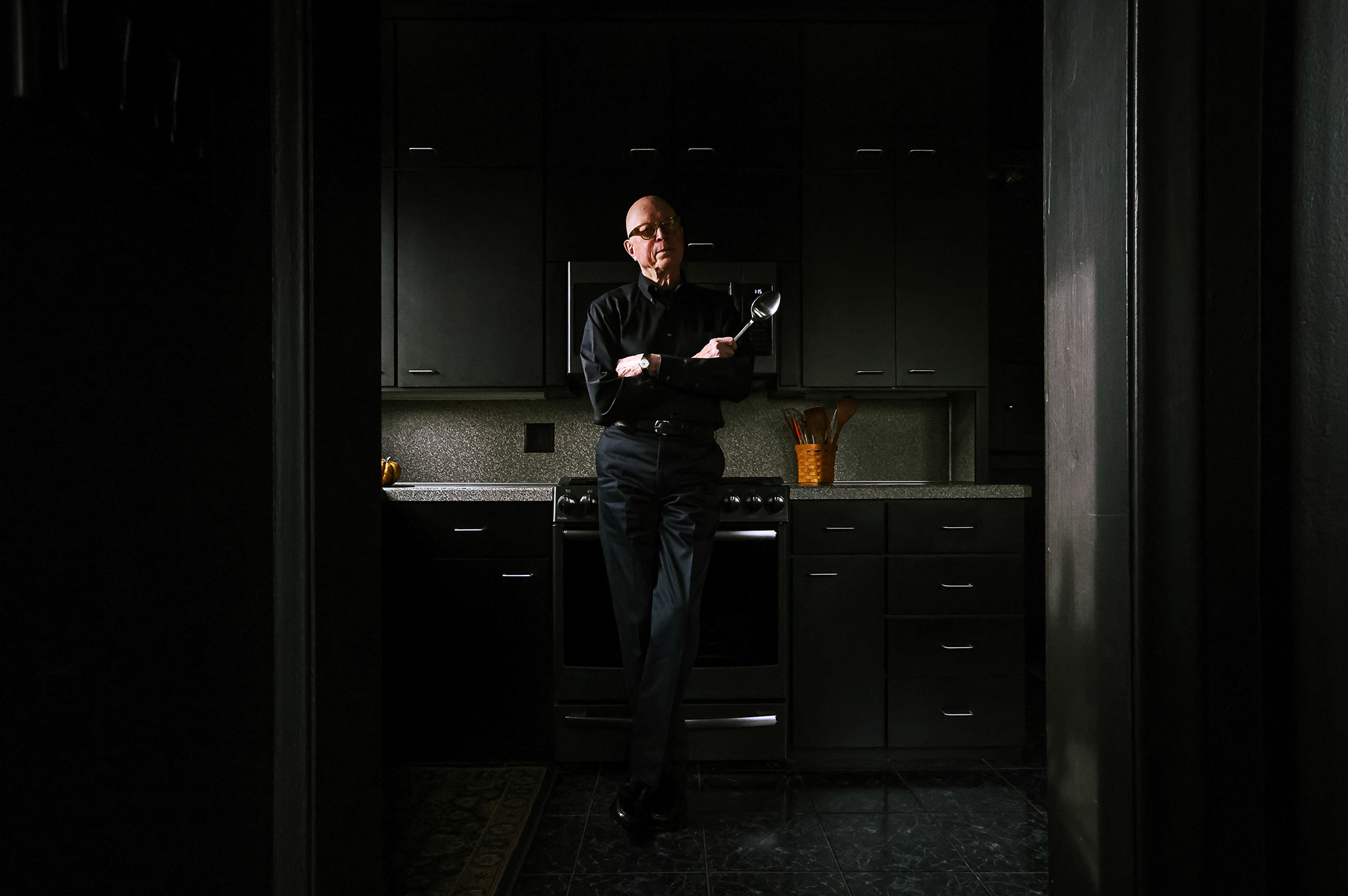 Richard Hebein stands in his kitchen following the release his new book, “The Old Professor’s Cookbook,” in Waterville, OH on Wednesday, December 1, 2021. Rather than a normal recipe book, Hebein used the book to teach readers not only recipes, but also techniques, historical context for recipes, and suggestions. For Toledo Blade.