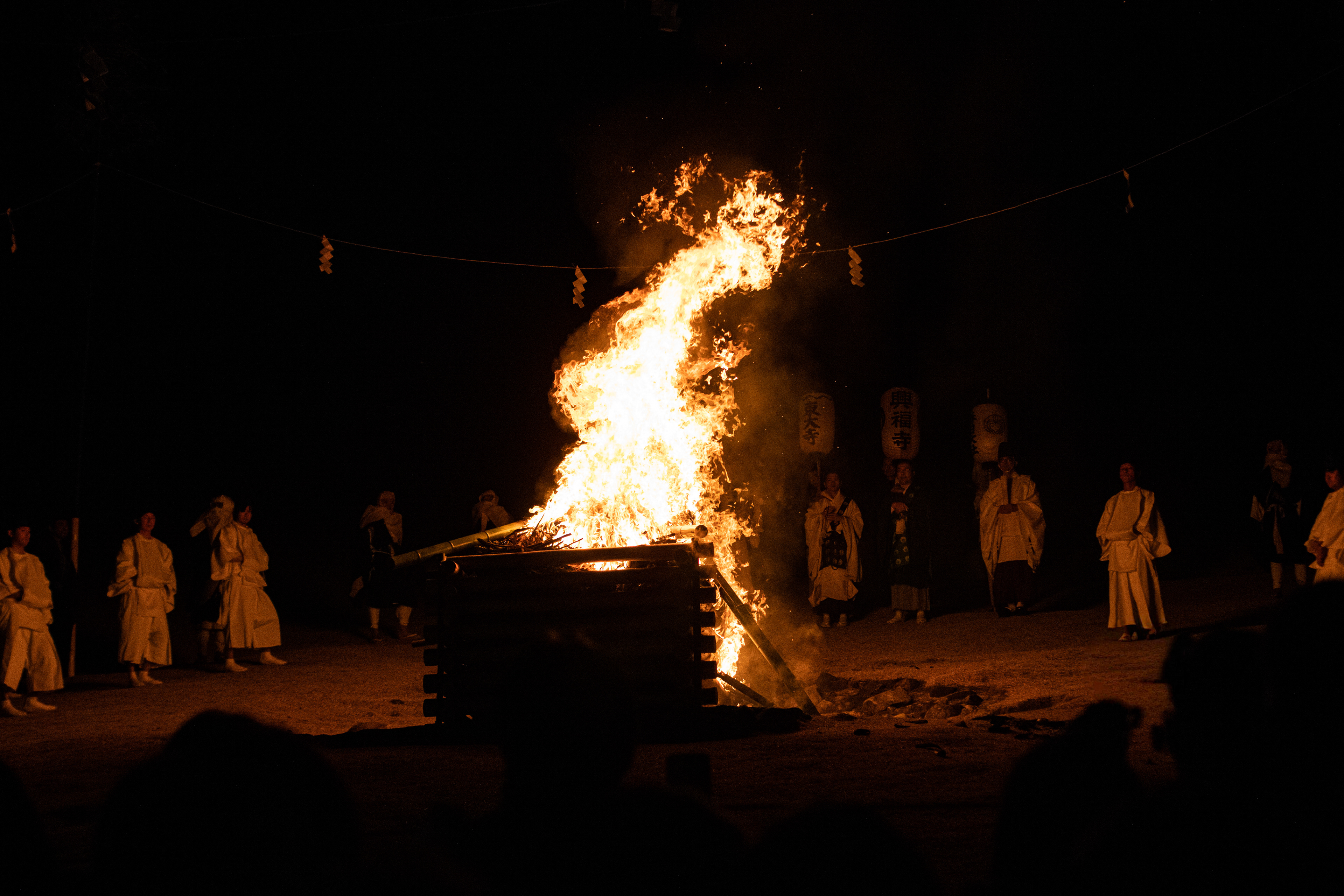 Monks gather around a bonfire during the Wakakusa Yamayaki fire lighting in Nara, Japan.