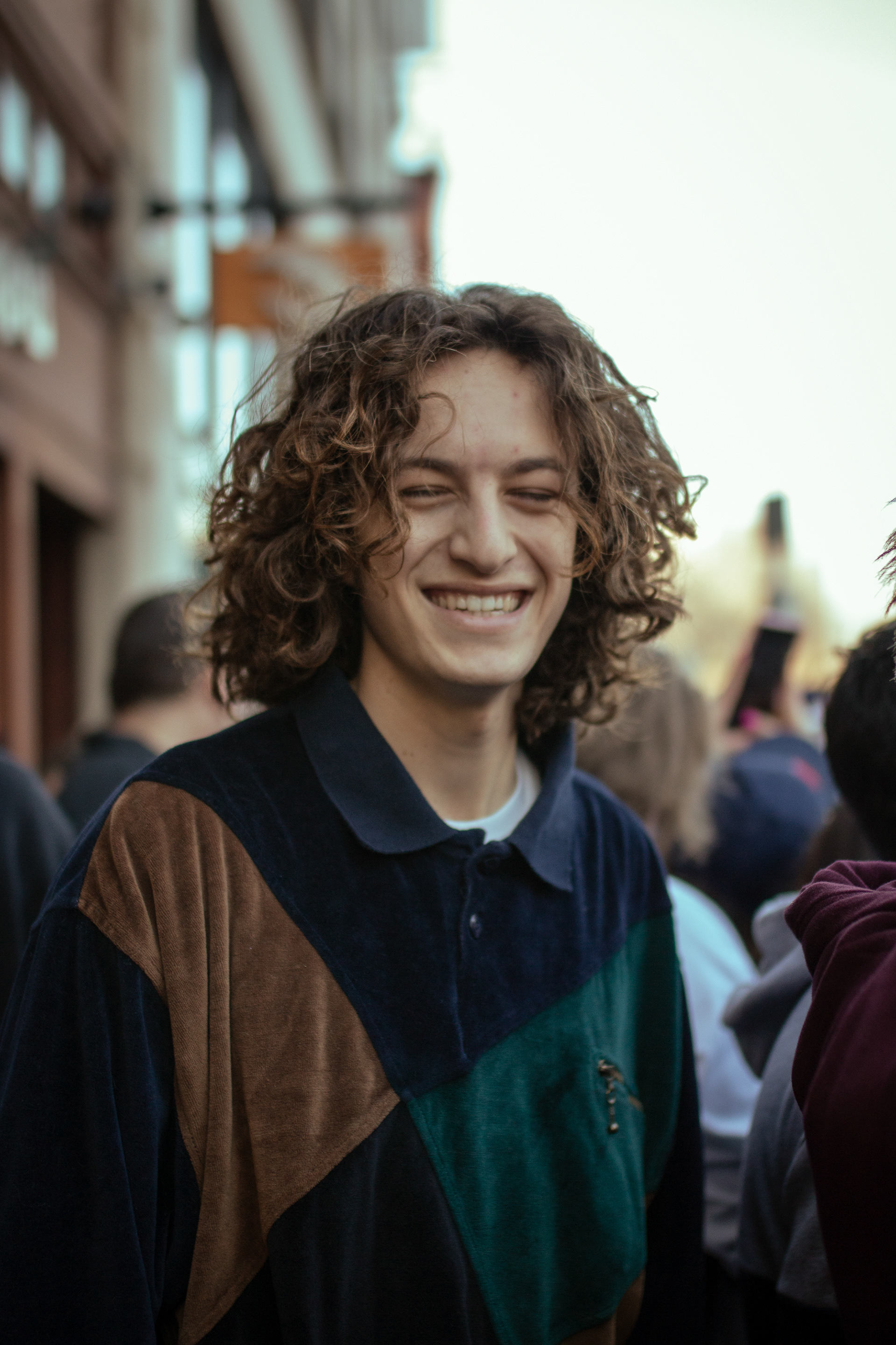 A parade attendee laughs as celebratory floats pass by during the Red Sox victory parade on Feb. 5, 2019.