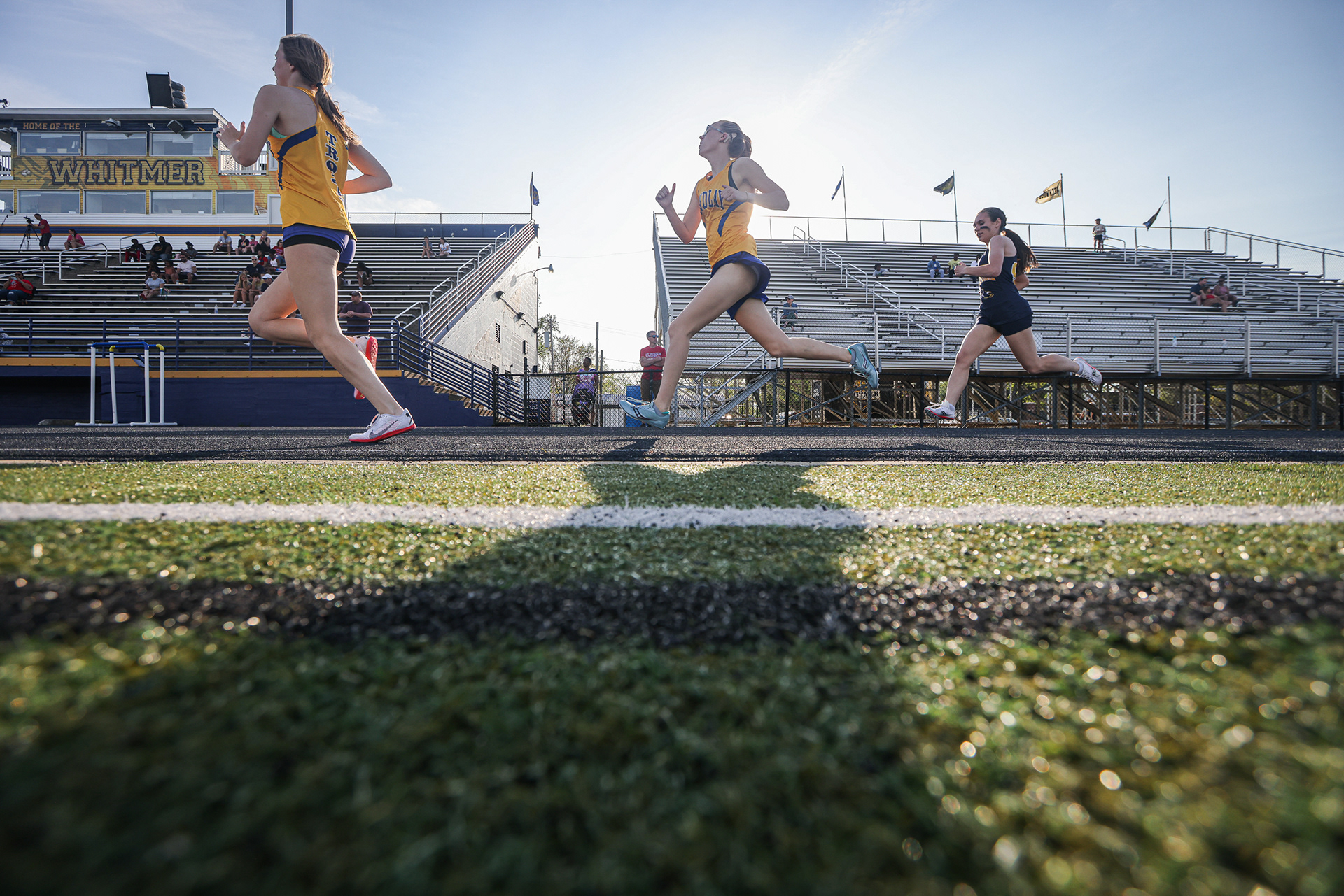 Girls jog through the last stretch of the 800 meter run final at the Three Rivers Athletic Conference track and field championship meet at Whitmer High School in Toledo, Ohio on Friday, May 13, 2022. For Toledo Blade.