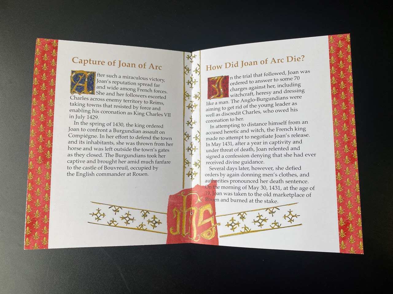 The red on this page is inspired by the red vestments priests wear for feast days of martyrs, and this page discusses St. Joan's death.