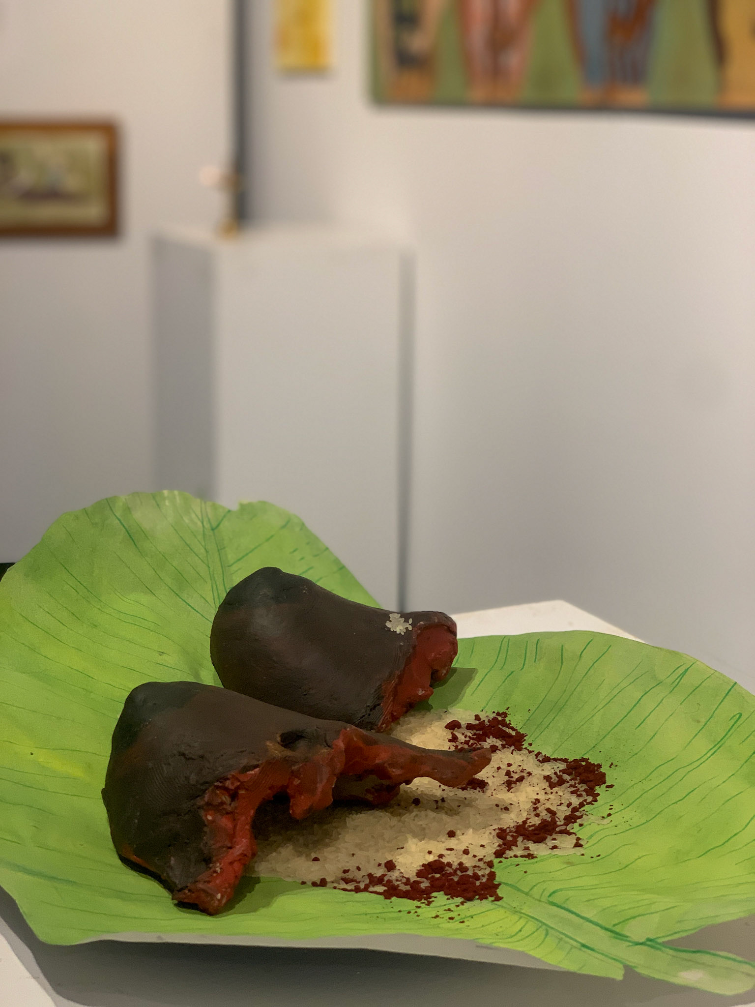The Price of Dignity, 2025, Clay, banana leaf, rice, and natural pigments