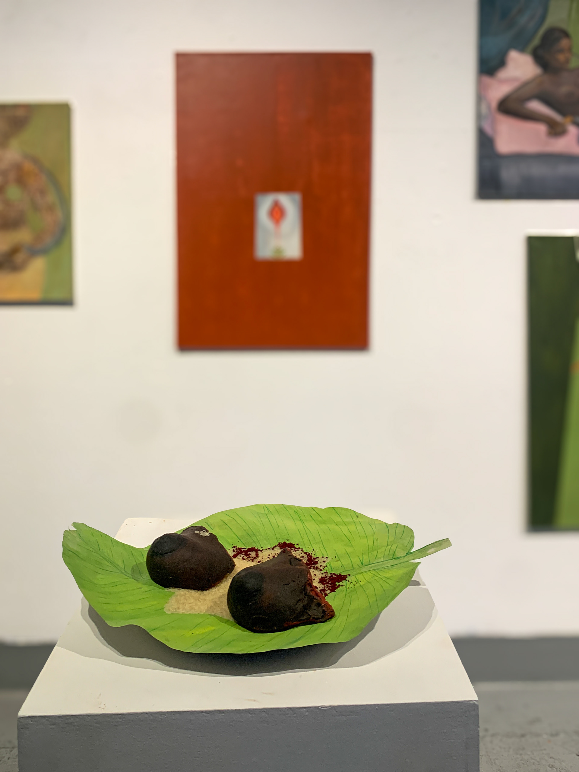 The Price of Dignity, 2025, Clay, banana leaf, rice, and natural pigments