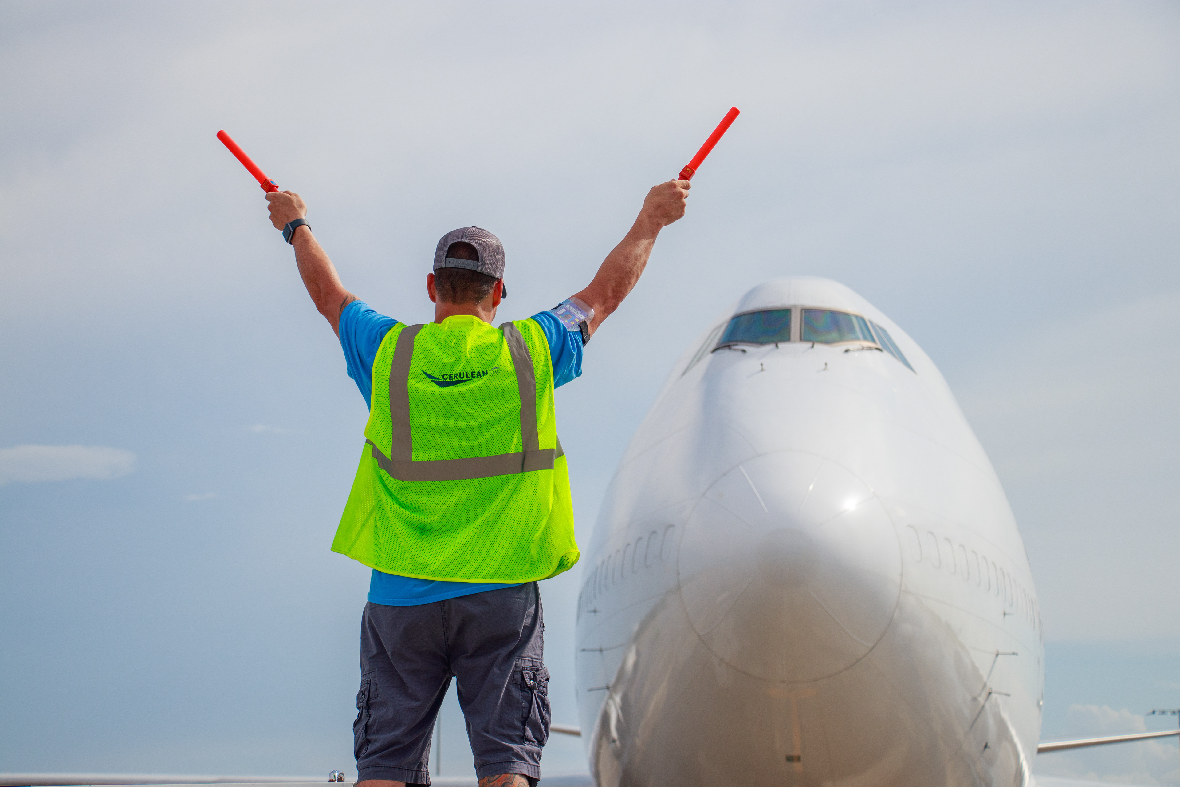 Cerulean employee waving in a 747 cargo plane.