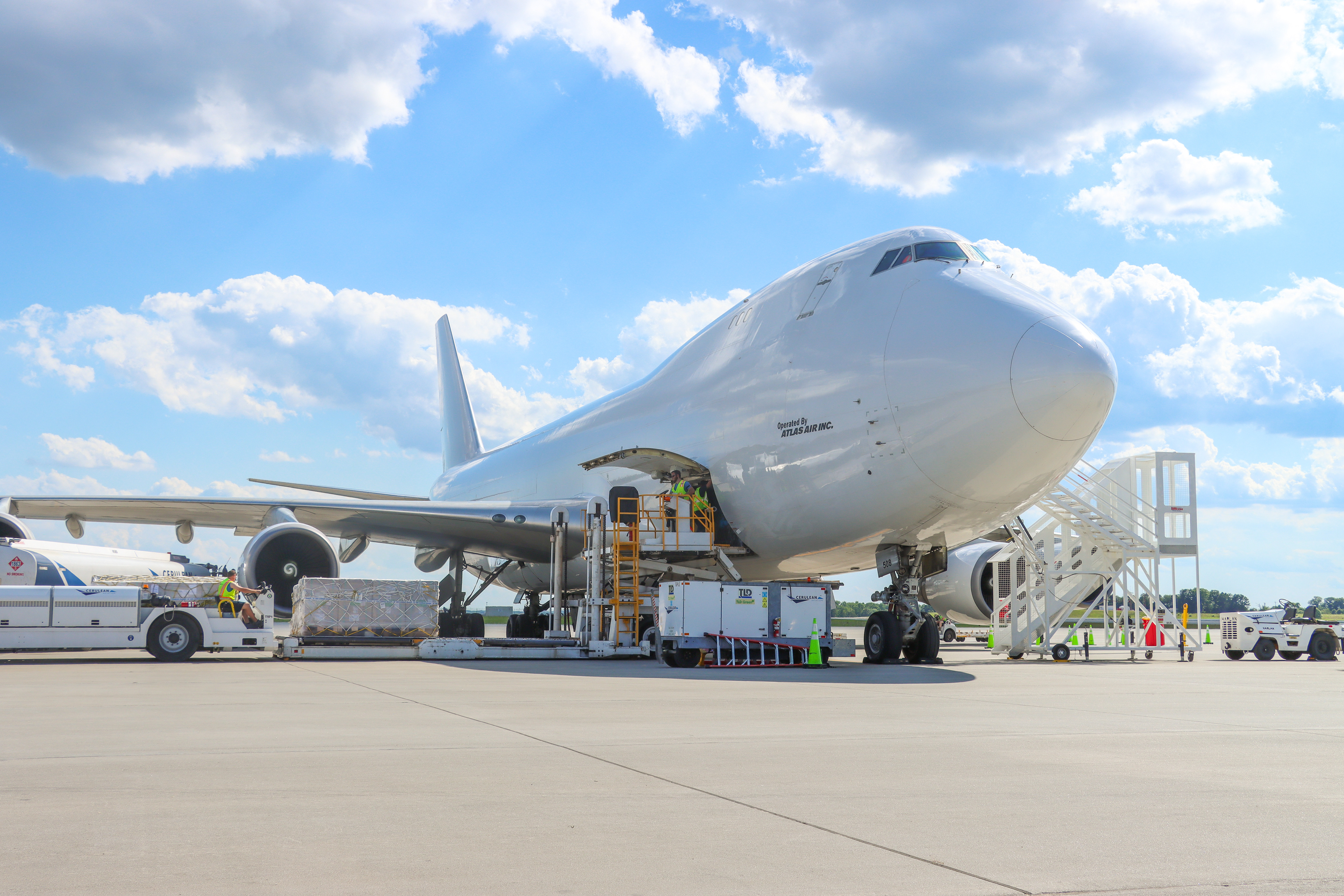 747 at the cargo apron being unloaded.