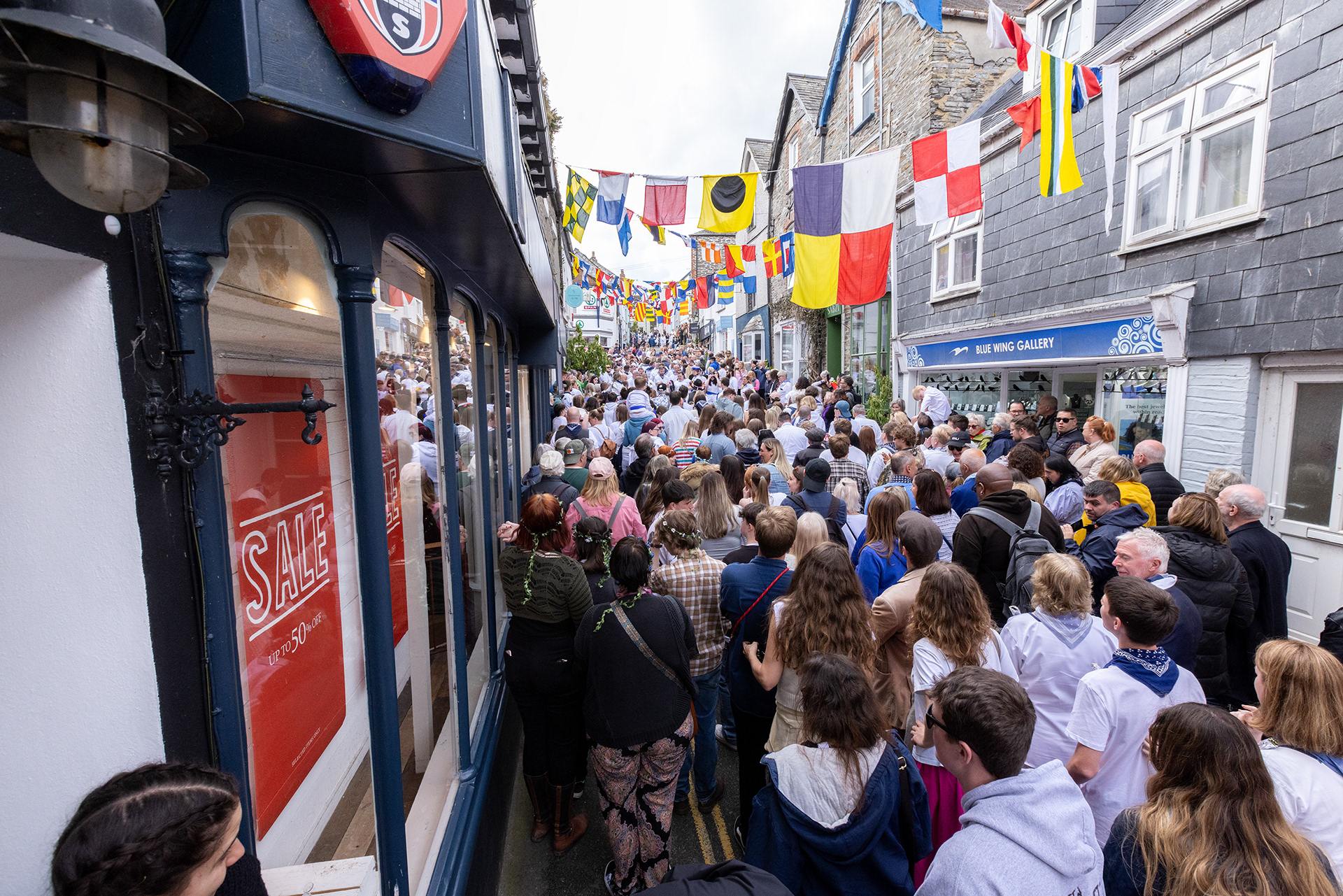 Crowds gather in the streets of Padstow for the annual May Day ‘Obby Oss’ celebrations. The tradition is seen to welcome the coming of summer and its origins are unknown, however the earliest mentions of its celebrations date back to 1803. © Luke Williams, 2024. All rights reserved.