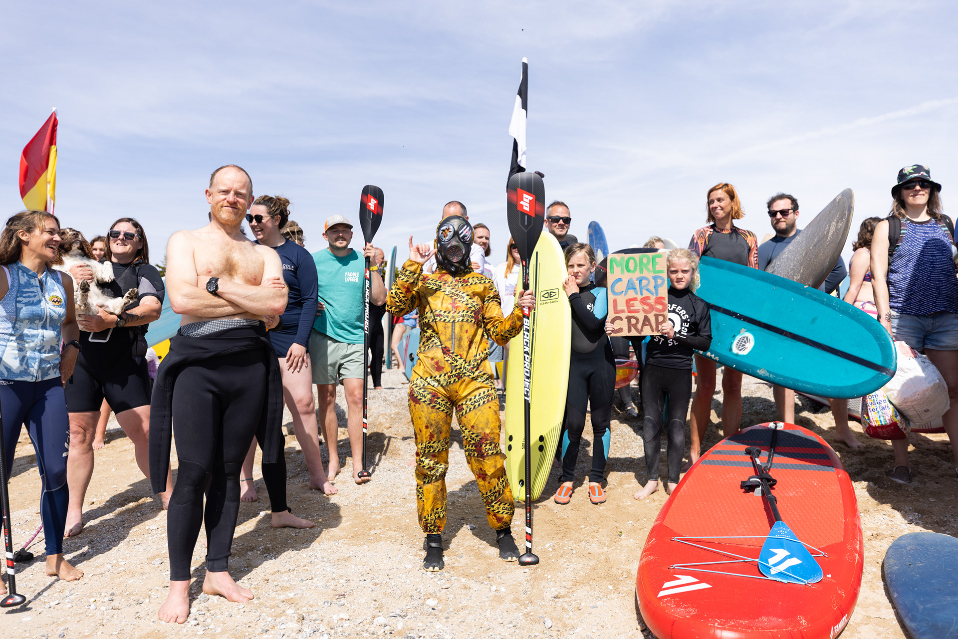 Locals take part in a Surfers Against Sewage 'paddle out' protest at Gyllyngvase Beach, Cornwall. Wanting to put an end to sewage pollution here in the UK, this was one of many paddle out protests that took place across the country. © Luke Williams, 2025. All rights reserved.