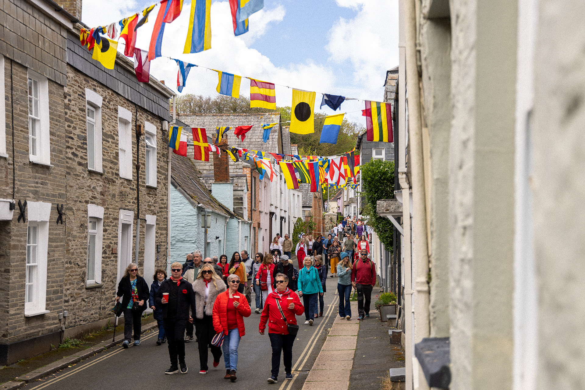 Crowds gather in the streets of Padstow for the annual May Day ‘Obby Oss’ celebrations. The tradition is seen to welcome the coming of summer and its origins are unknown, however the earliest mentions of its celebrations date back to 1803. © Luke Williams, 2024. All rights reserved.