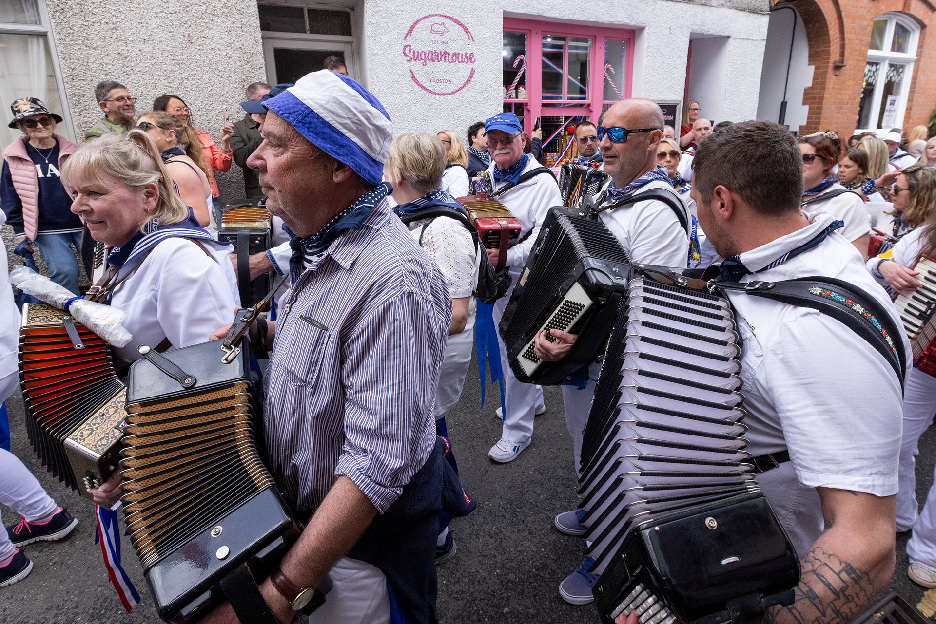 Crowds gather in the streets of Padstow for the annual May Day ‘Obby Oss’ celebrations. The tradition is seen to welcome the coming of summer and its origins are unknown, however the earliest mentions of its celebrations date back to 1803. © Luke Williams, 2024. All rights reserved.