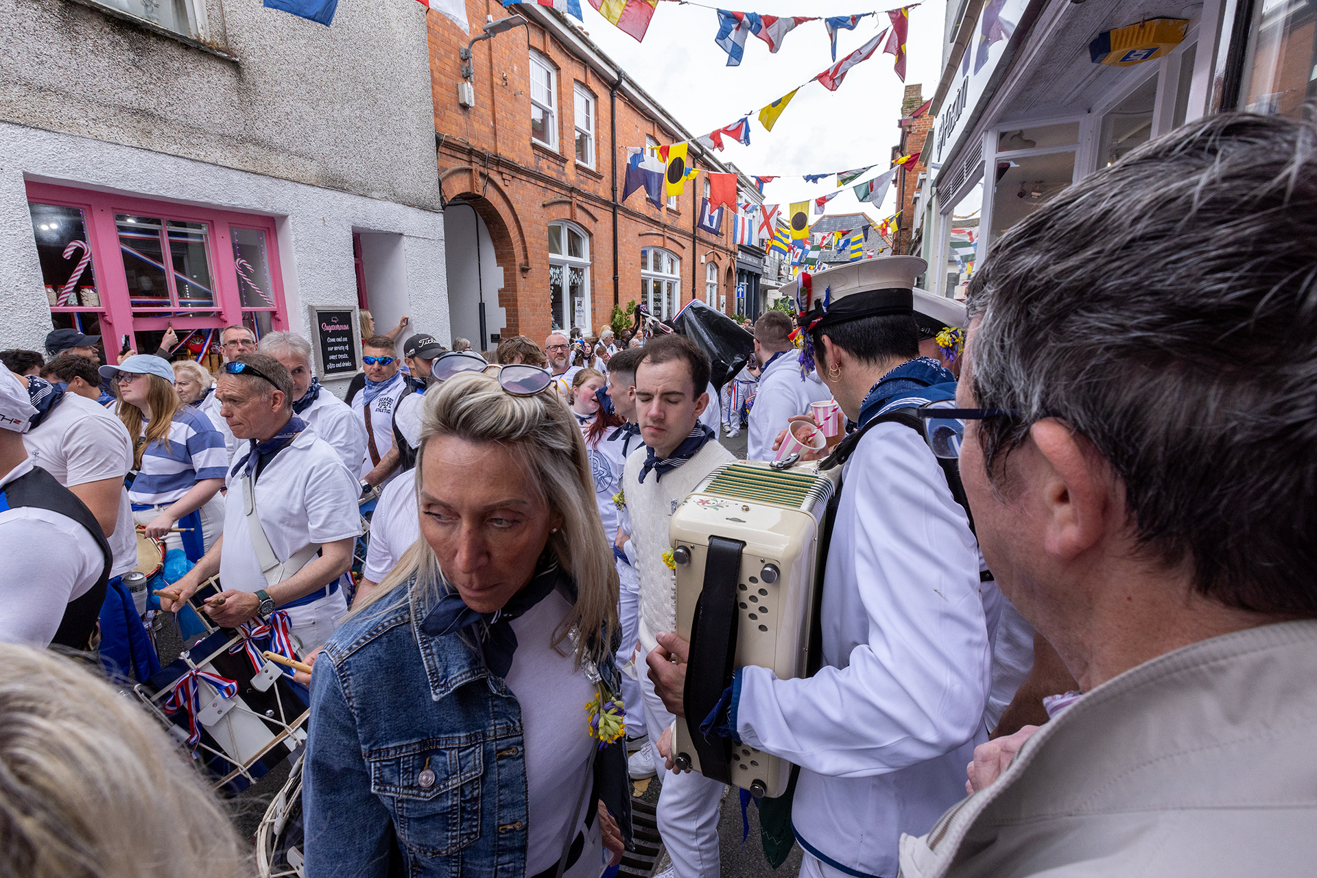 Crowds gather in the streets of Padstow for the annual May Day ‘Obby Oss’ celebrations. The tradition is seen to welcome the coming of summer and its origins are unknown, however the earliest mentions of its celebrations date back to 1803. © Luke Williams, 2024. All rights reserved.