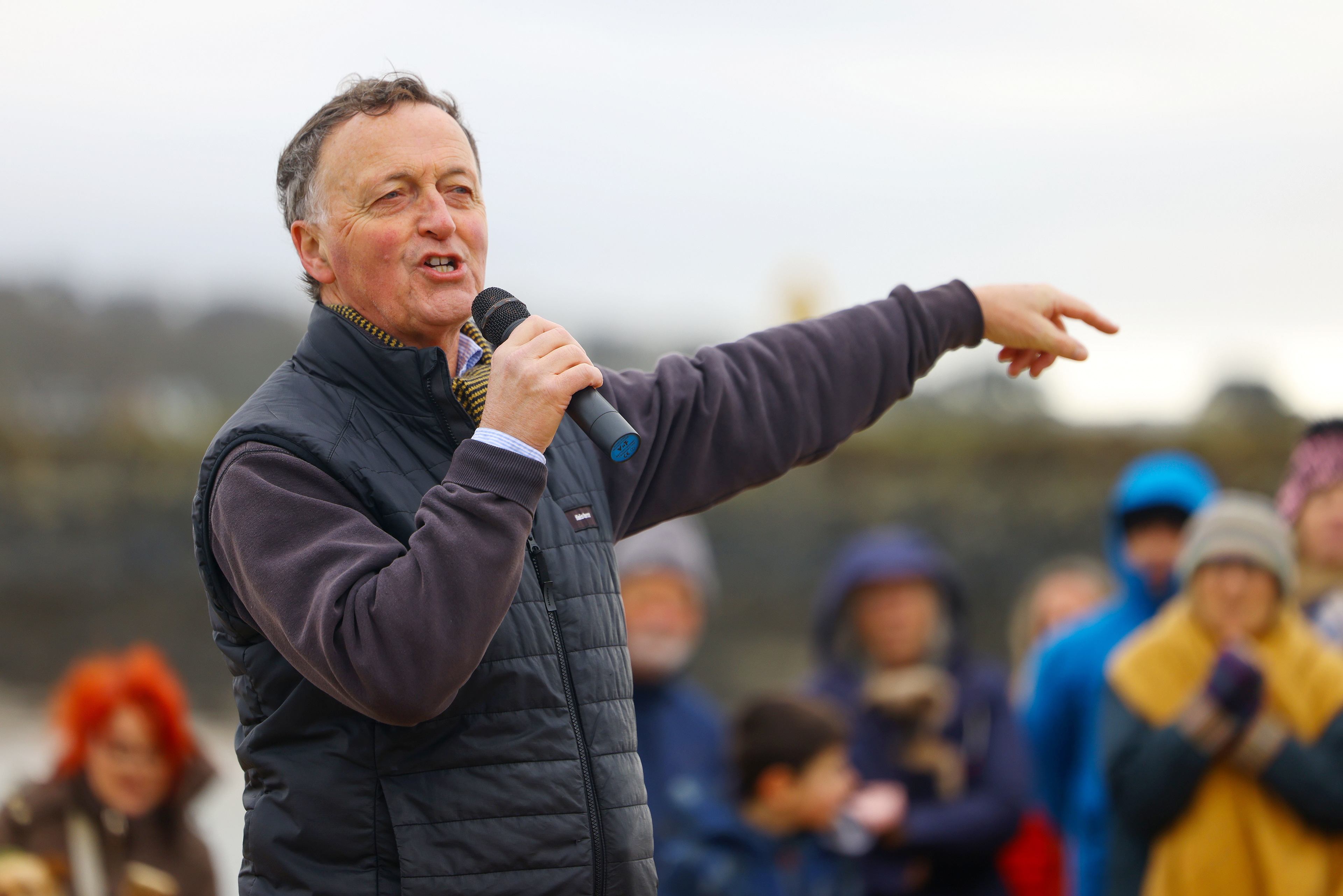 Demonstrators gather during an SOS Cornwall protest that is trying to prevent the selling off of sand from Hayle Beach in Cornwall, England. There has been outrage and concerns recently that sand is being 'stolen' from the beach. Hayle Towans Beach was voted the United Kingdom’s best beach in 2024. Shot for Stella Pictures LTD