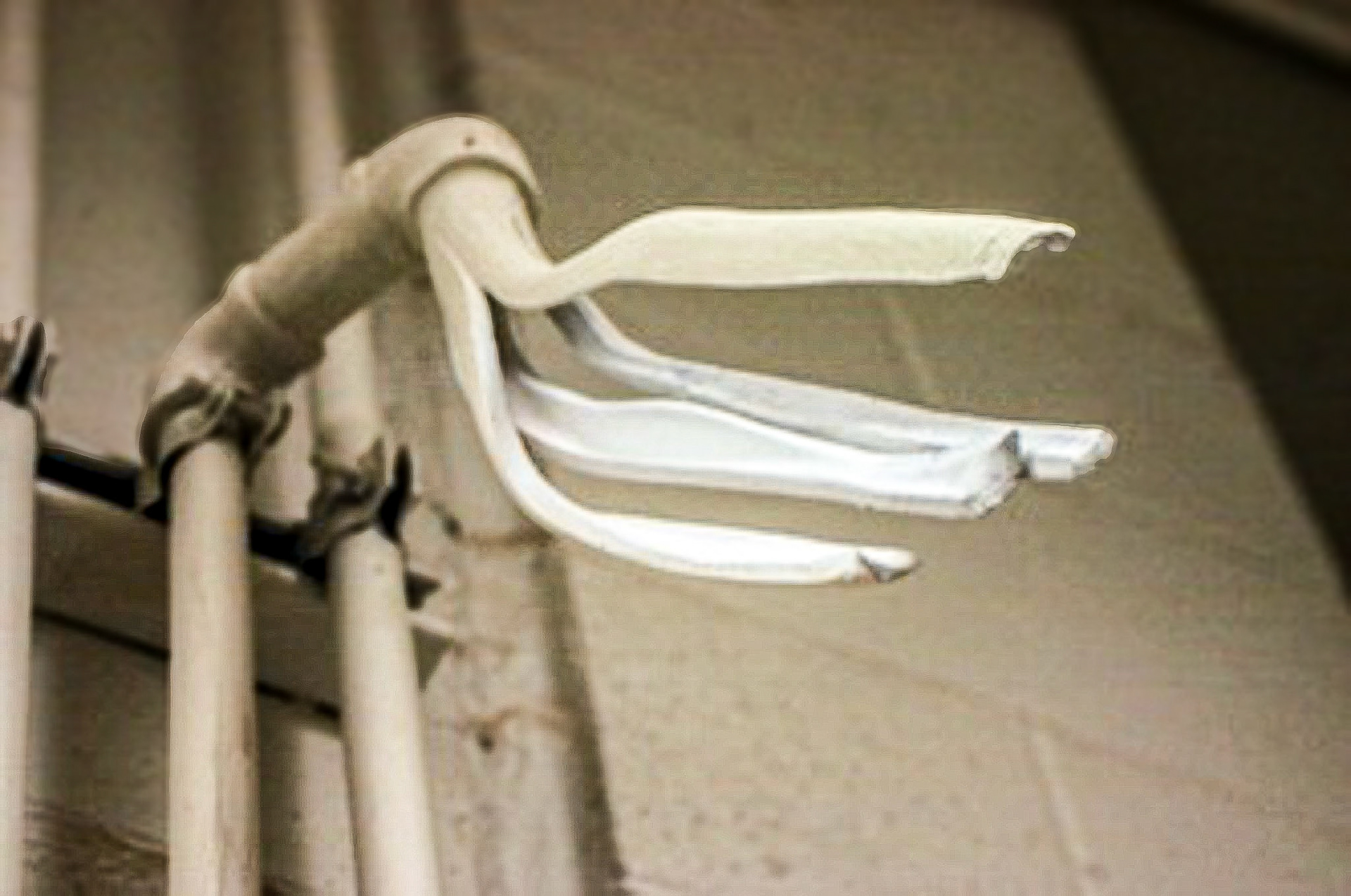 It’s Not What You Think, 2009, Slip Cast Clay,  Wall Paint, Dirt, Metal Pipe Fitting