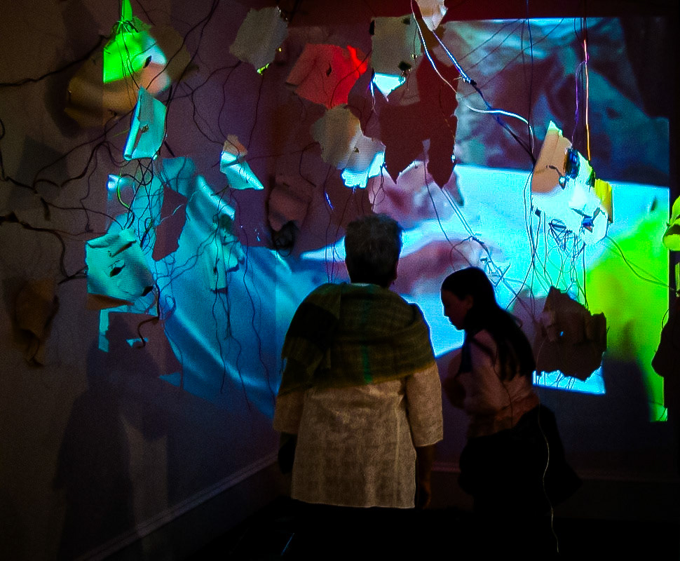 Diffusion  Porcelain, gold luster, gold leaf, found computer components, wire, video projection., 2011